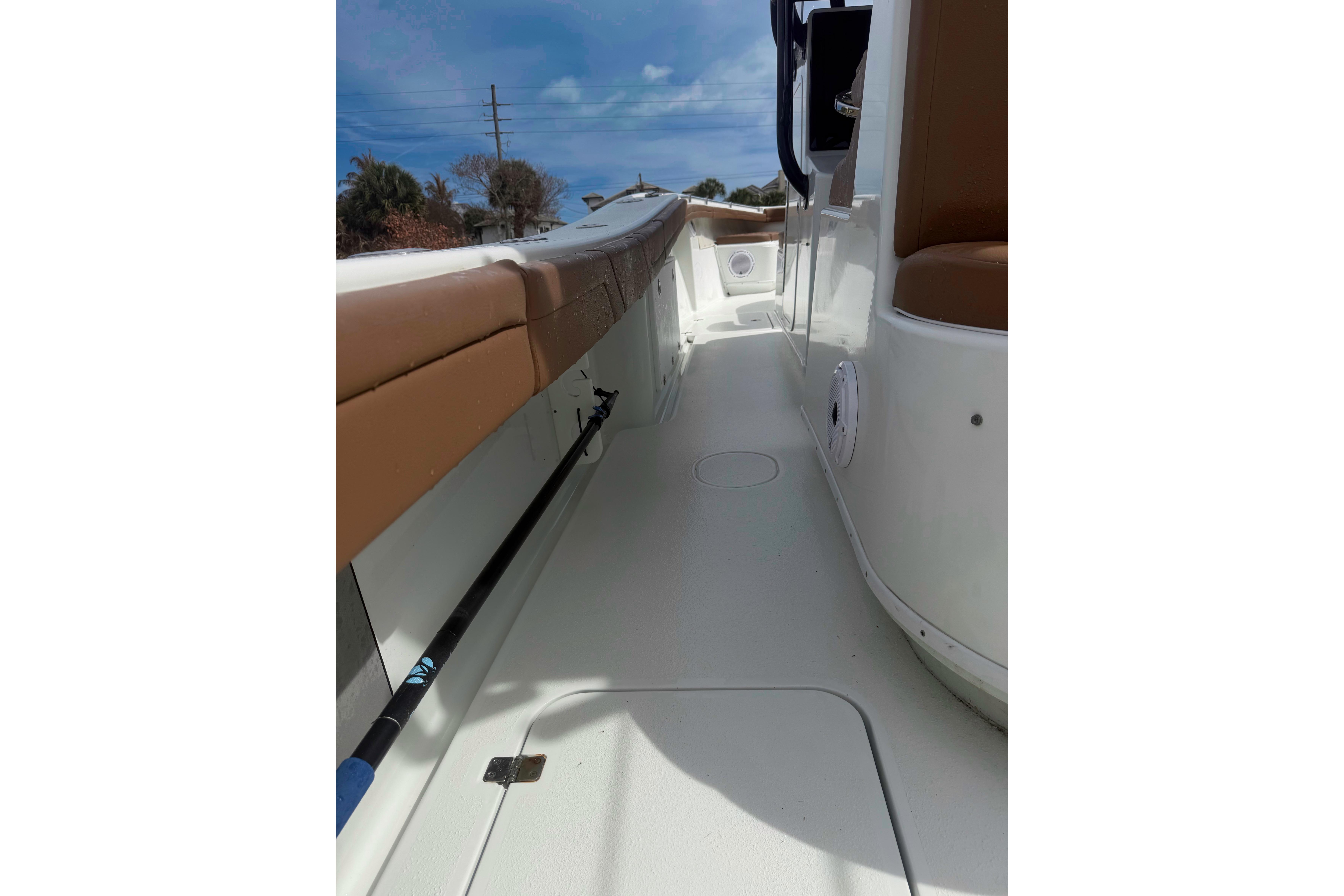 2018 Yellowfin 36 Offshore boat interior with tan seating and fishing rod holder.