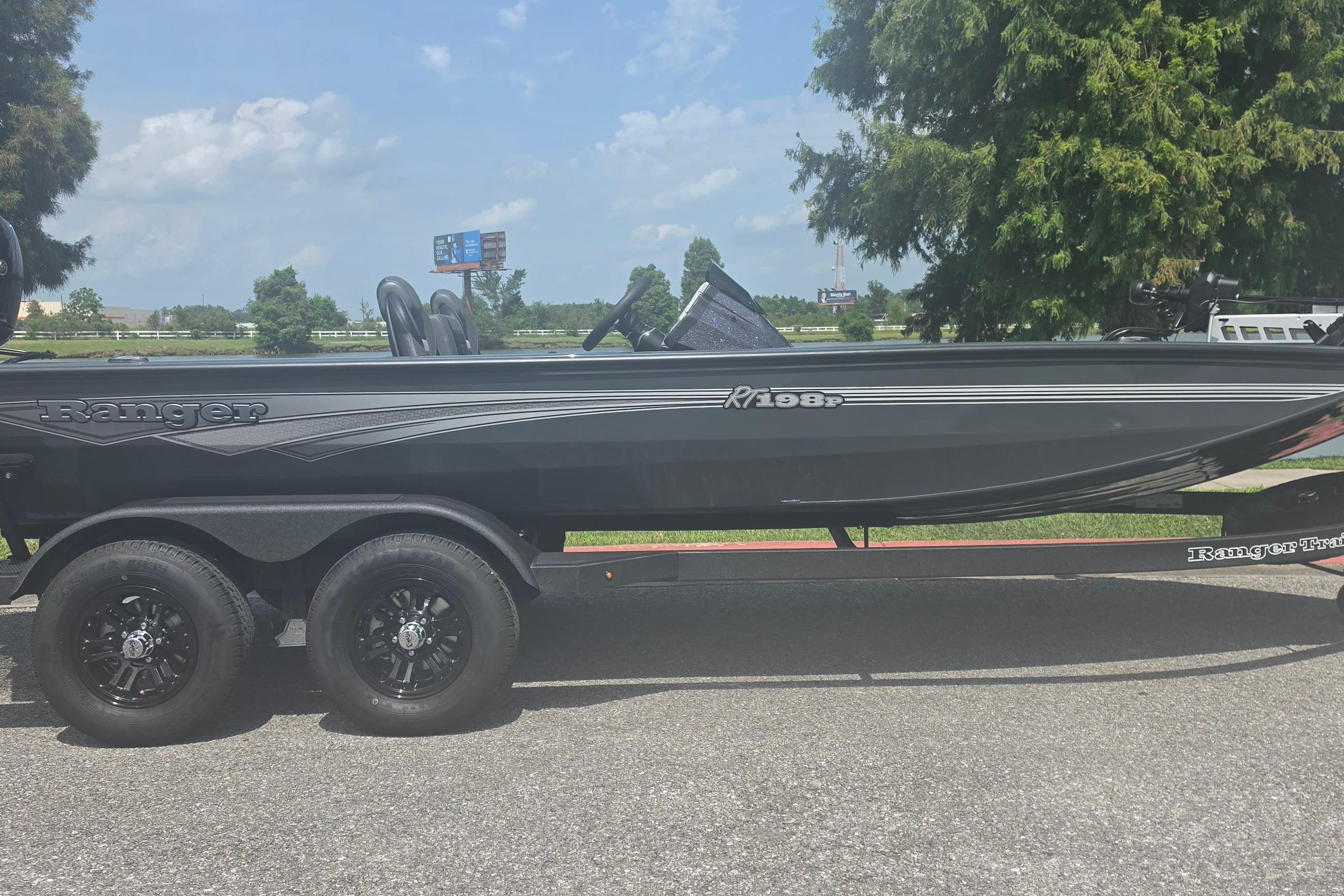 2026 Ranger RT198P boat on trailer, parked outdoors on a sunny day.