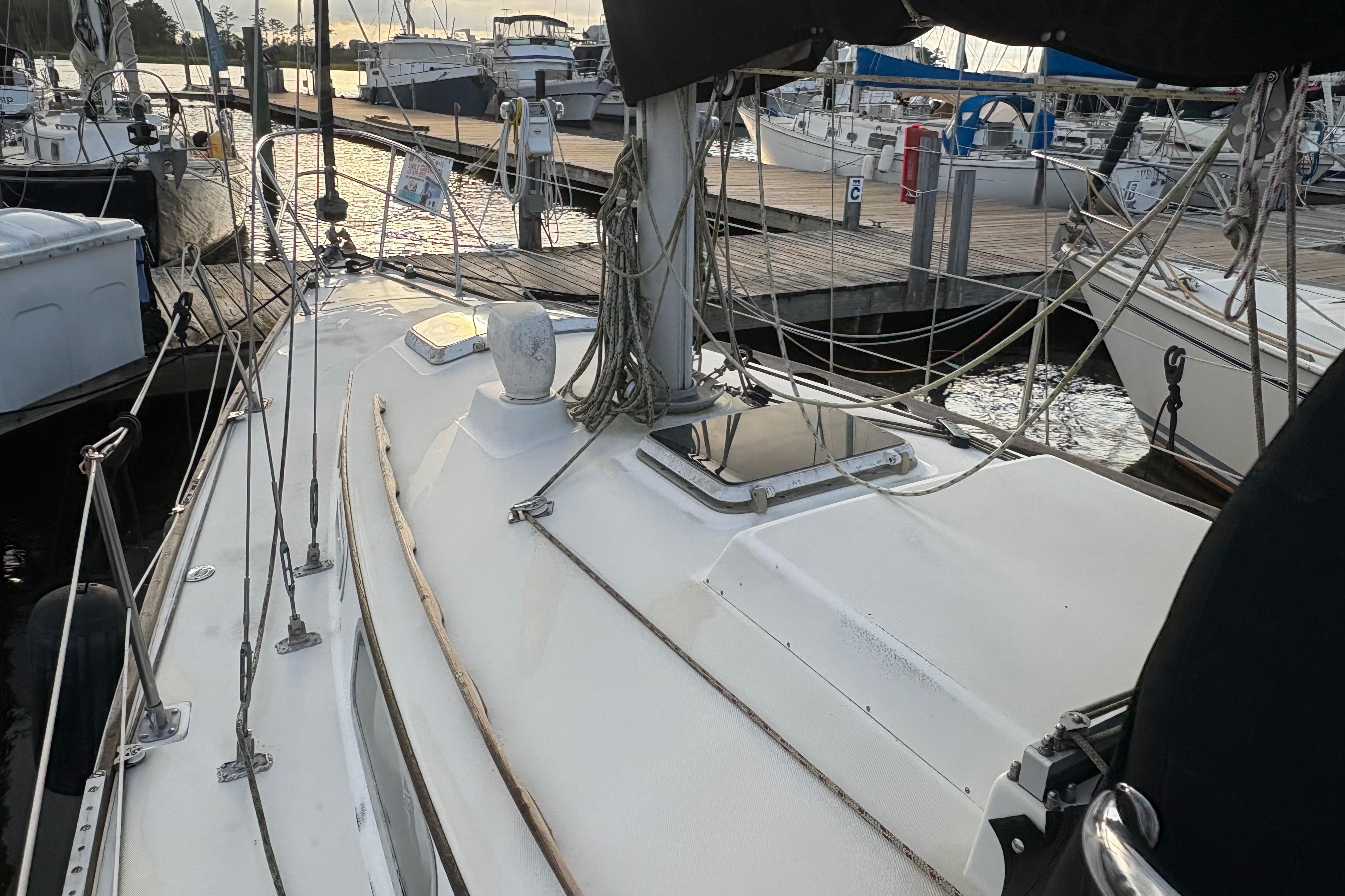 1981 Sabre 31 sailboat docked at marina, showing deck and rigging details.