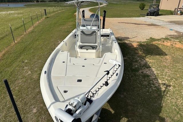 2023 Skeeter SX240 boat on grass, featuring a sleek design and modern equipment.