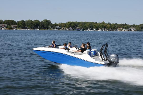 2025 Starcraft SV 16 OB boat speeding on a lake with passengers.