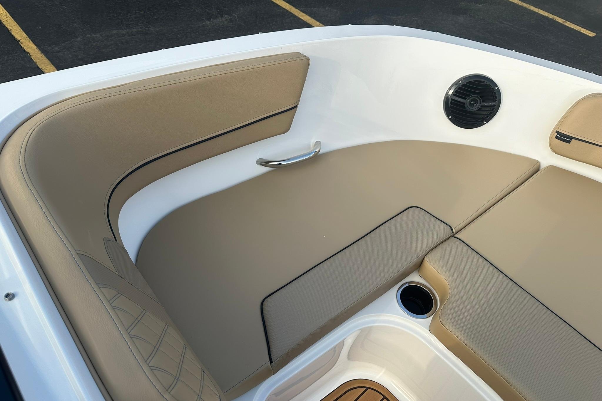 2026 Bayliner VR6 Bowrider OB interior with beige seating and speaker.