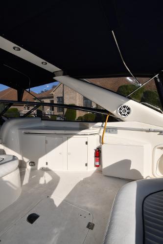 Interior view of 1997 Sunseeker Camargue 47 yacht, featuring sleek white design and modern amenities.