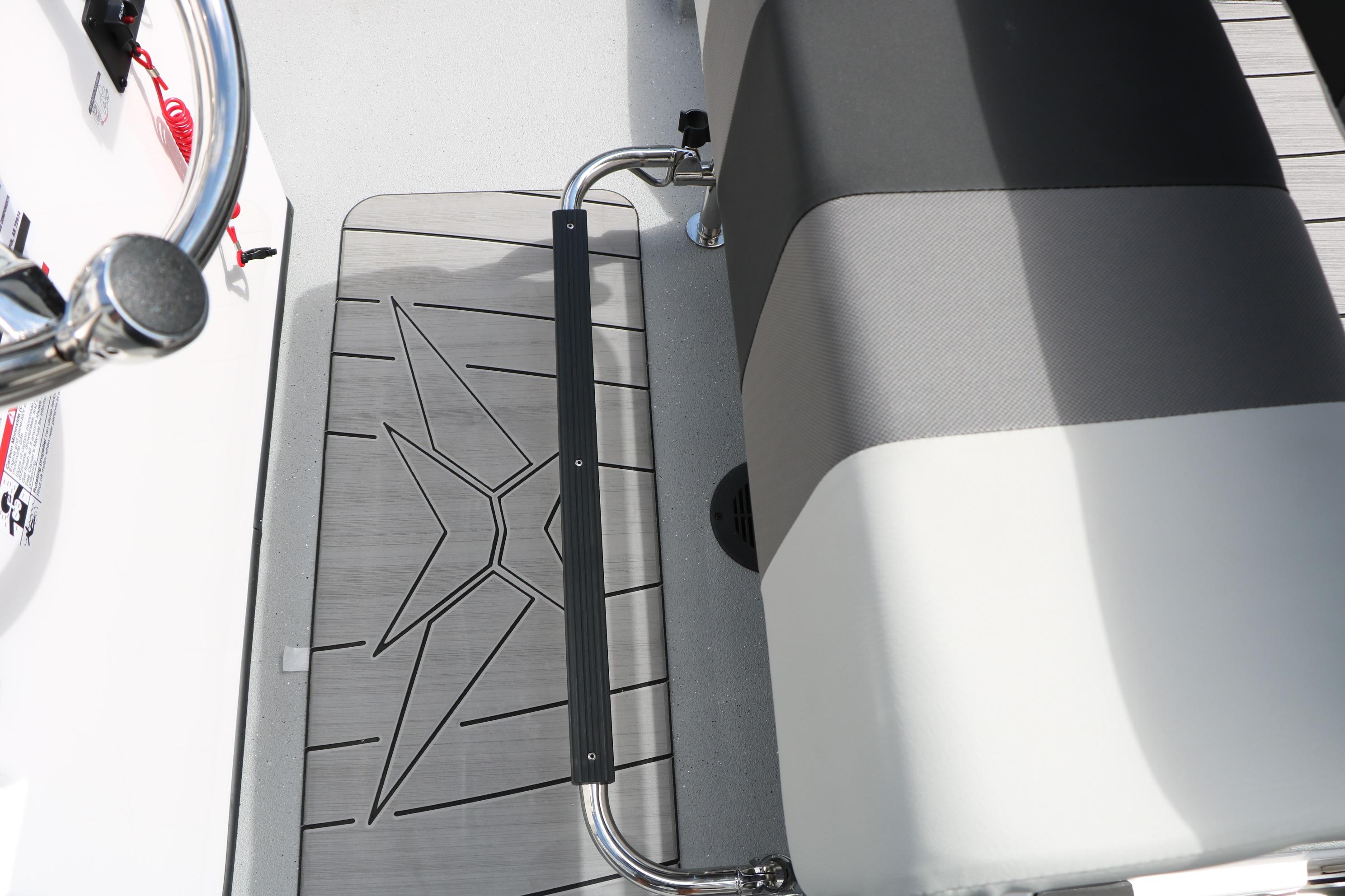 Interior of 2026 Vexus Defender 201 boat, featuring sleek seating and stylish flooring design.