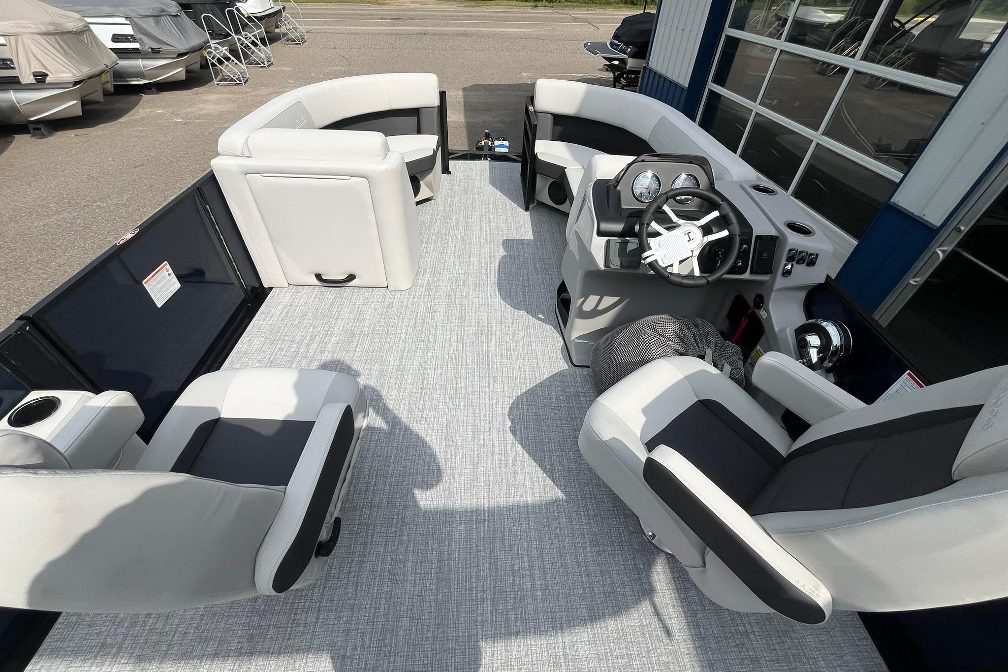 2026 Harris Cruiser 210 boat interior with modern seating and steering console.