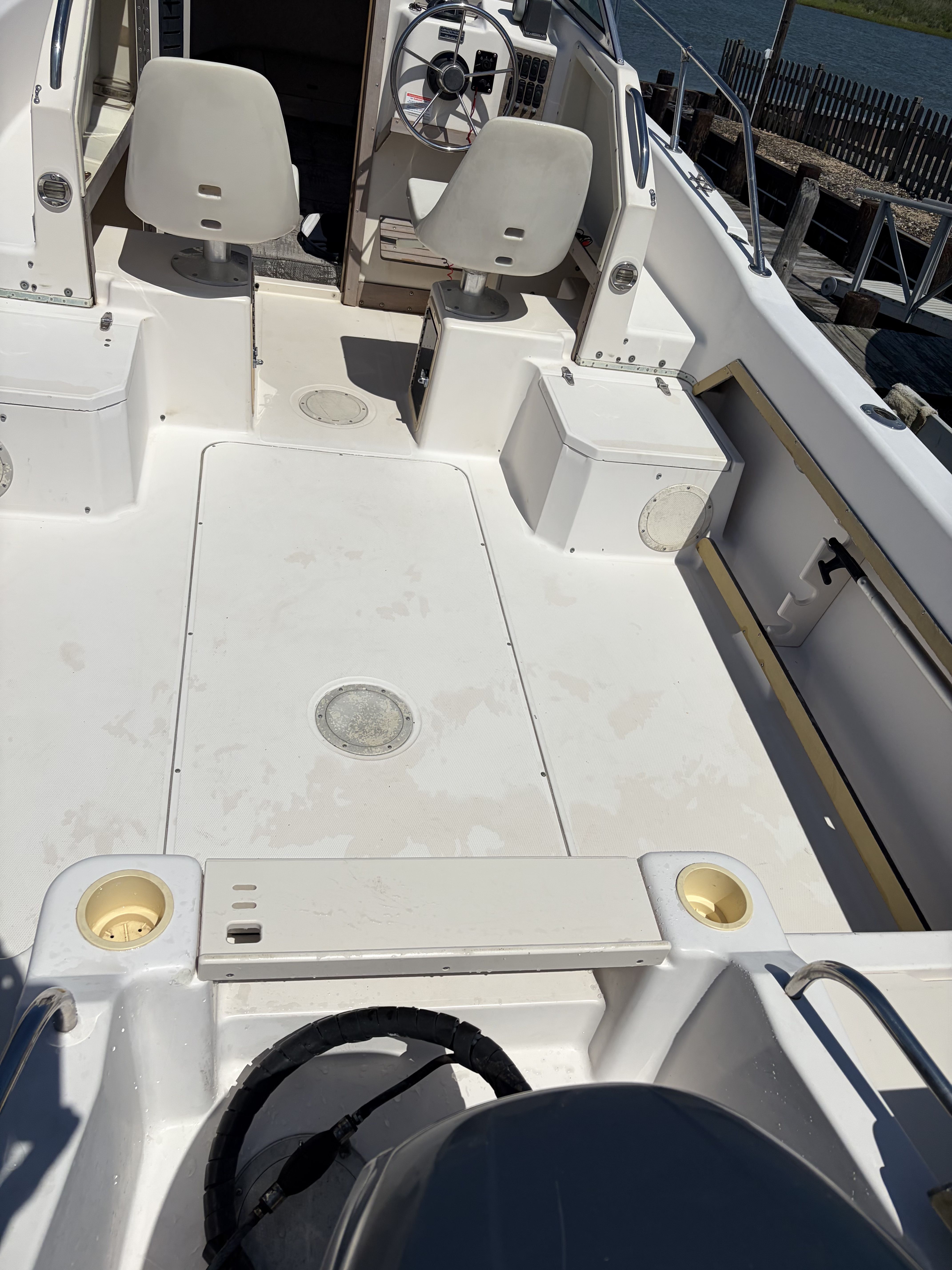 The image shows the cockpit of a 1993 Grady-White Adventure 208 boat with two seats.