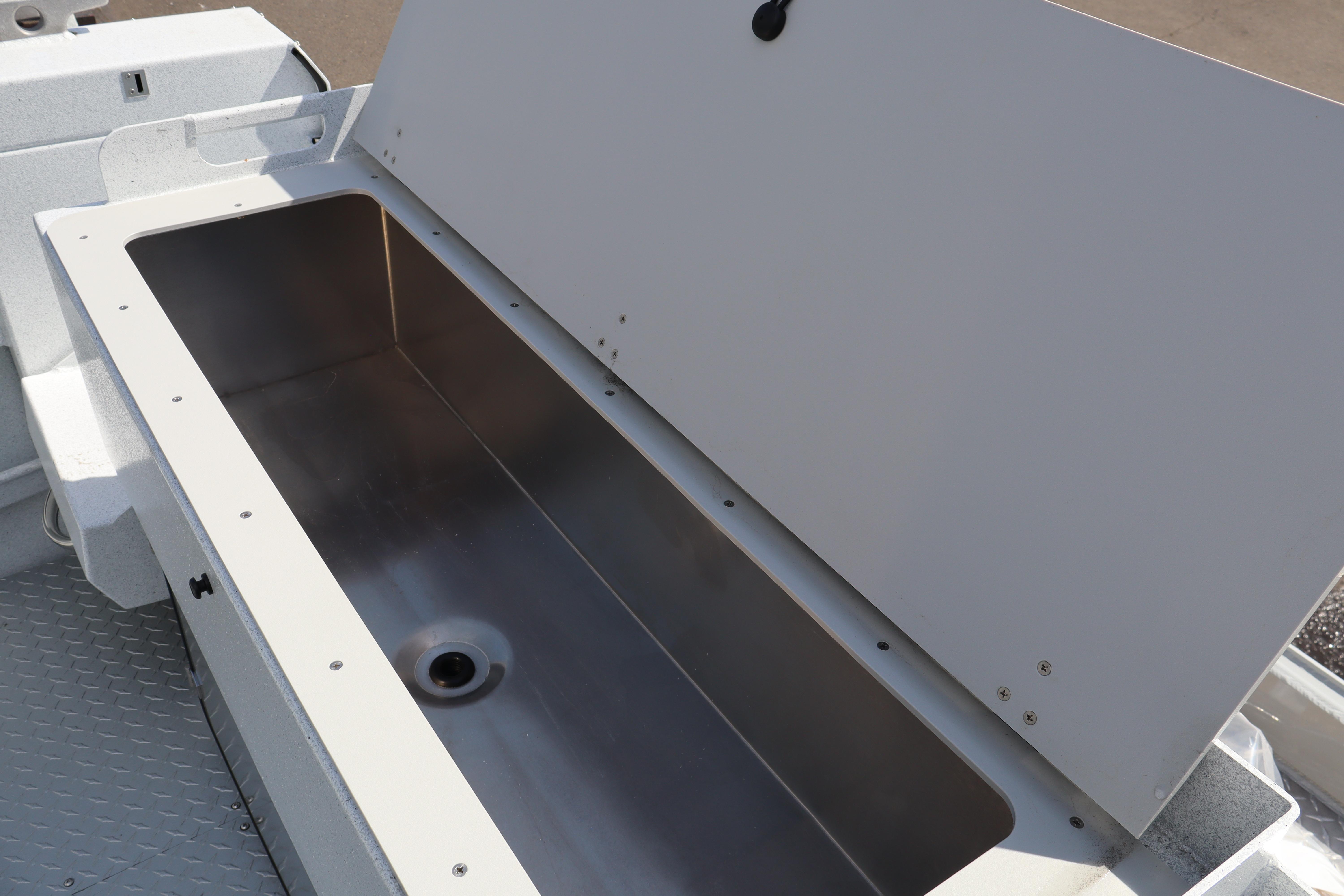 Open storage compartment on 2026 KingFisher 2425 Escape HT boat.