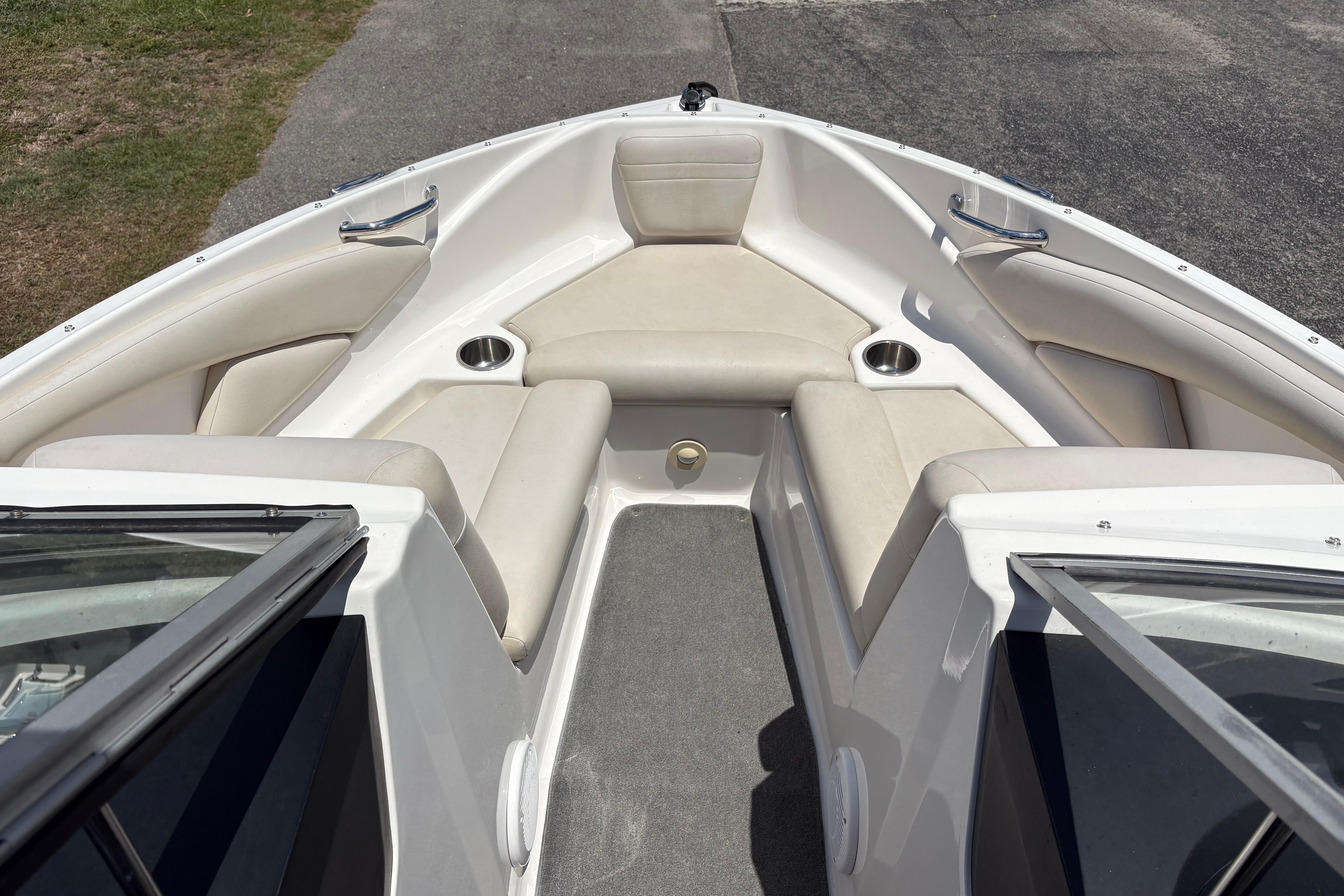 2008 Regal 1900 Bowrider boat interior with beige seating and cup holders.