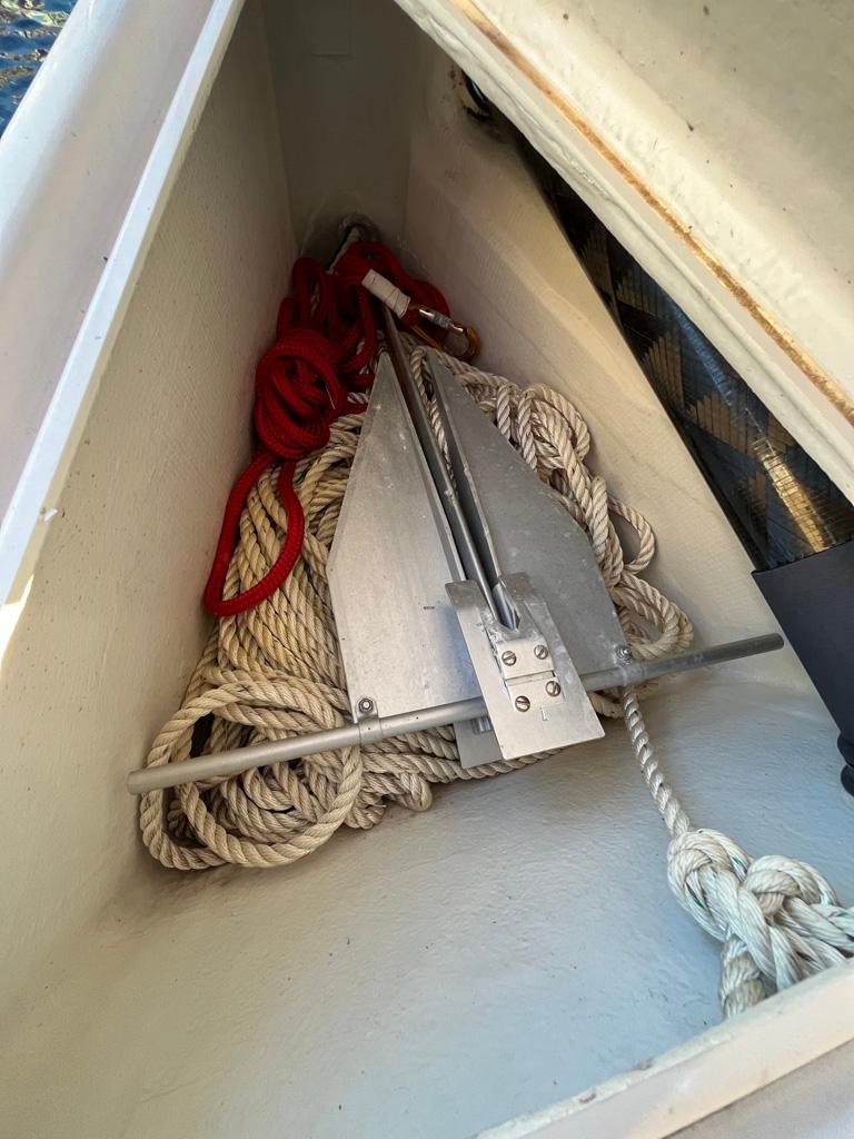 Anchor and ropes stored in a Seascape 27 sailboat compartment, 2018 model.
