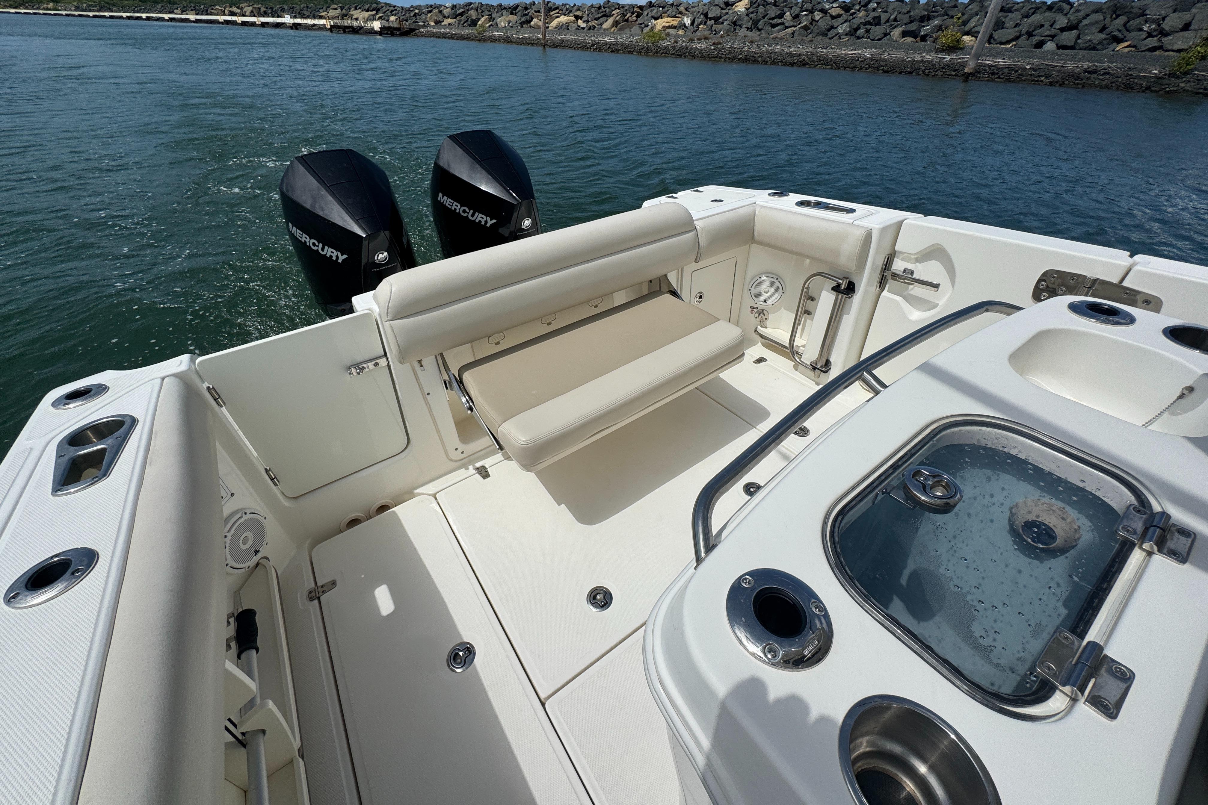 2022 Boston Whaler 280 Outrage boat interior with seating and dual Mercury engines.