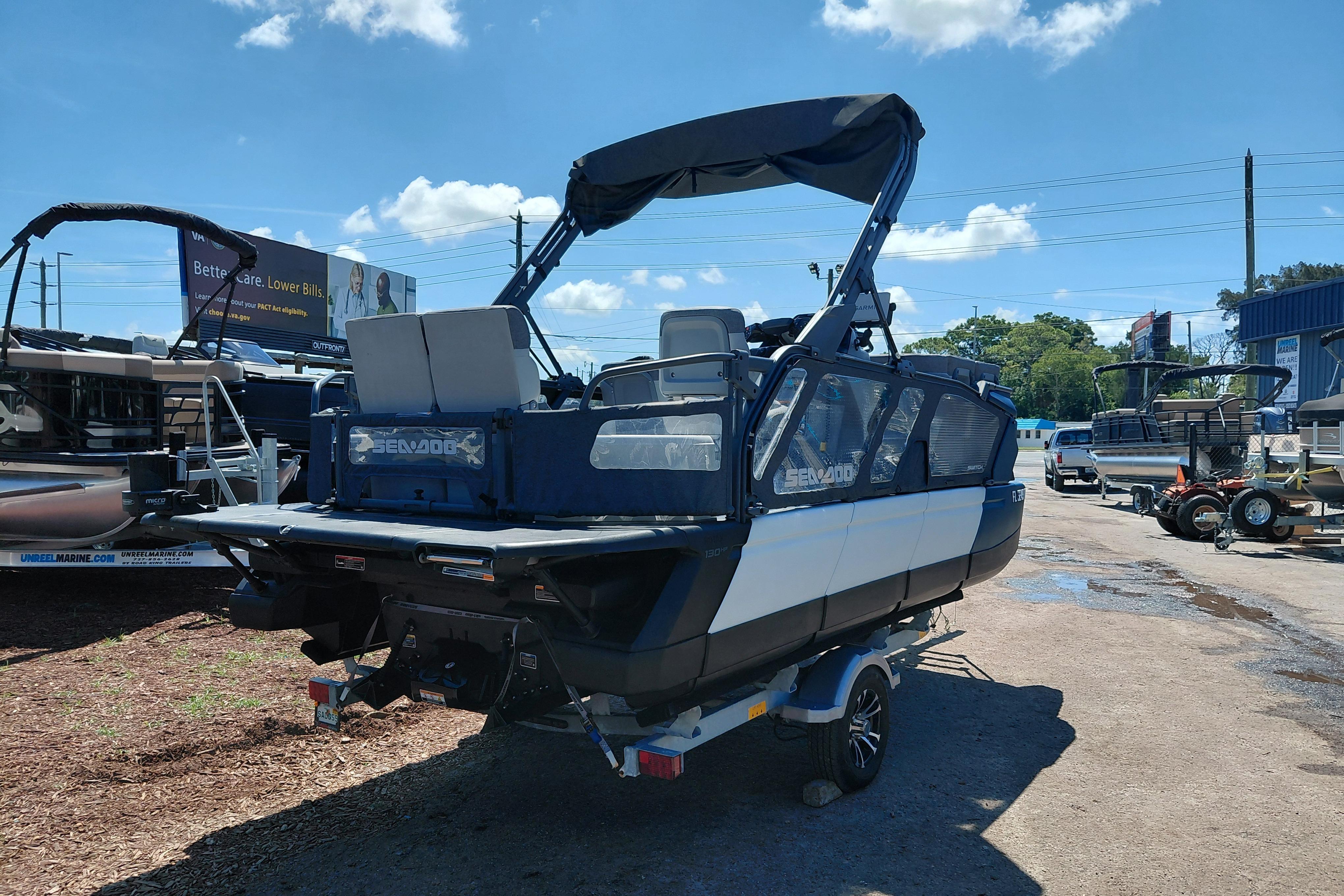 2024 Sea-Doo Switch Cruise 18 pontoon boat on trailer, outdoor dealership display.