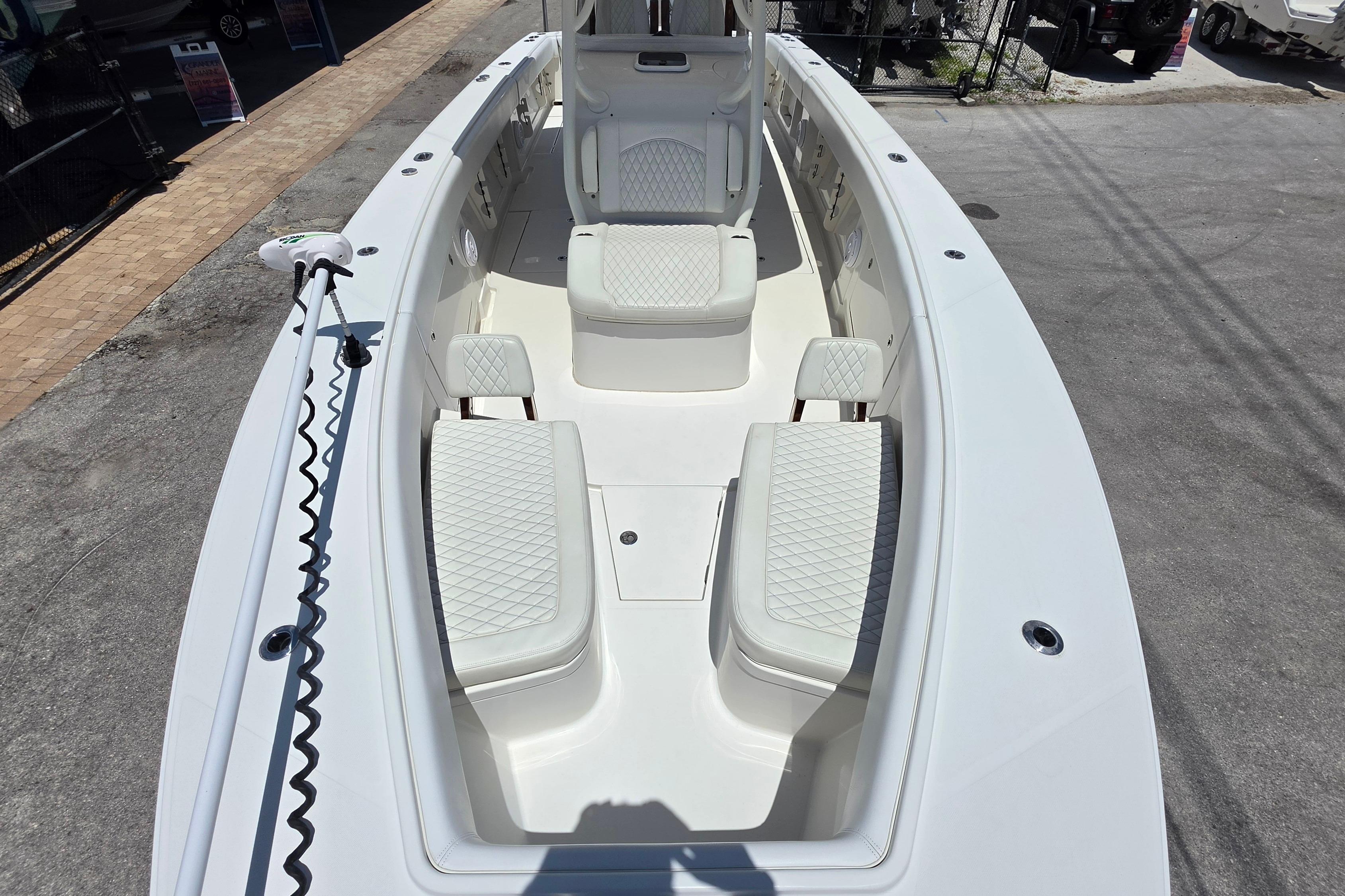 2020 Jupiter 34 HFS boat interior with white cushioned seating and spacious deck.