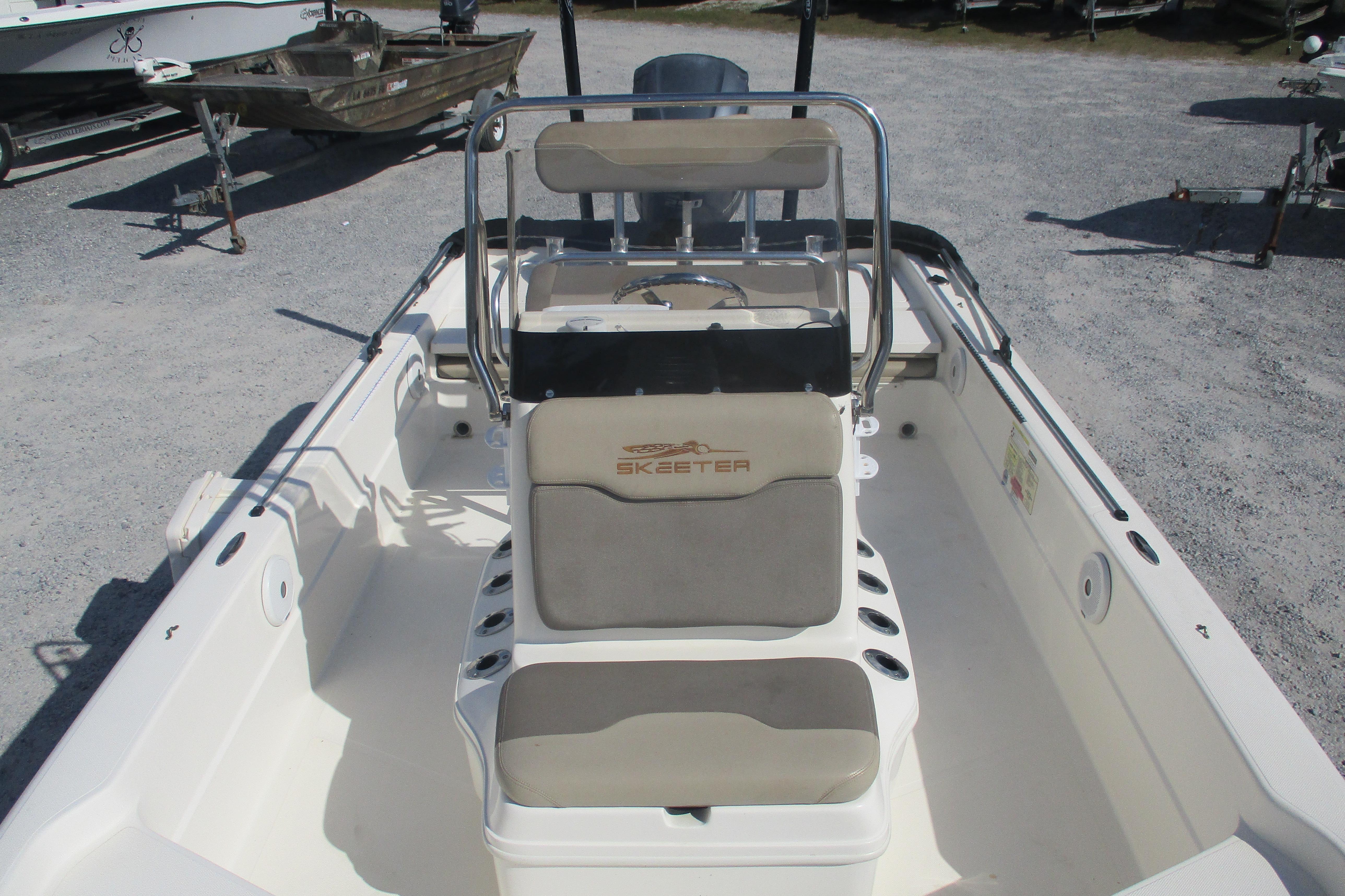 2014 Skeeter SX240 boat interior with seating and steering console.