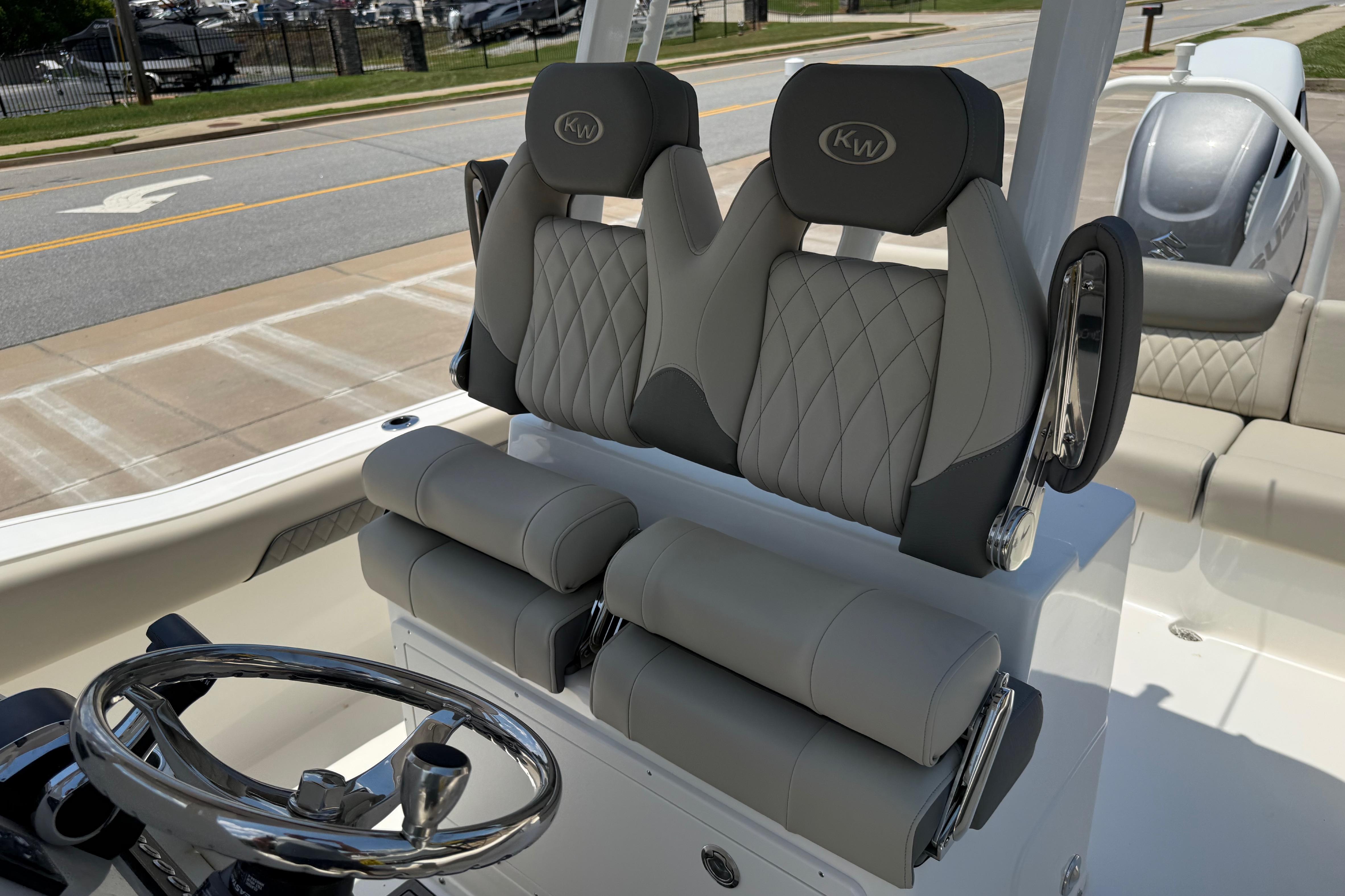2027 Key West 249 FS boat interior with dual seats and steering wheel.