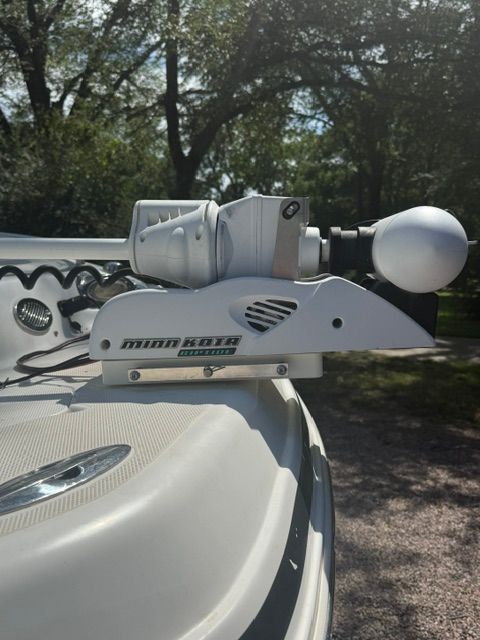 Close-up of a Minn Kota trolling motor on a boat.
