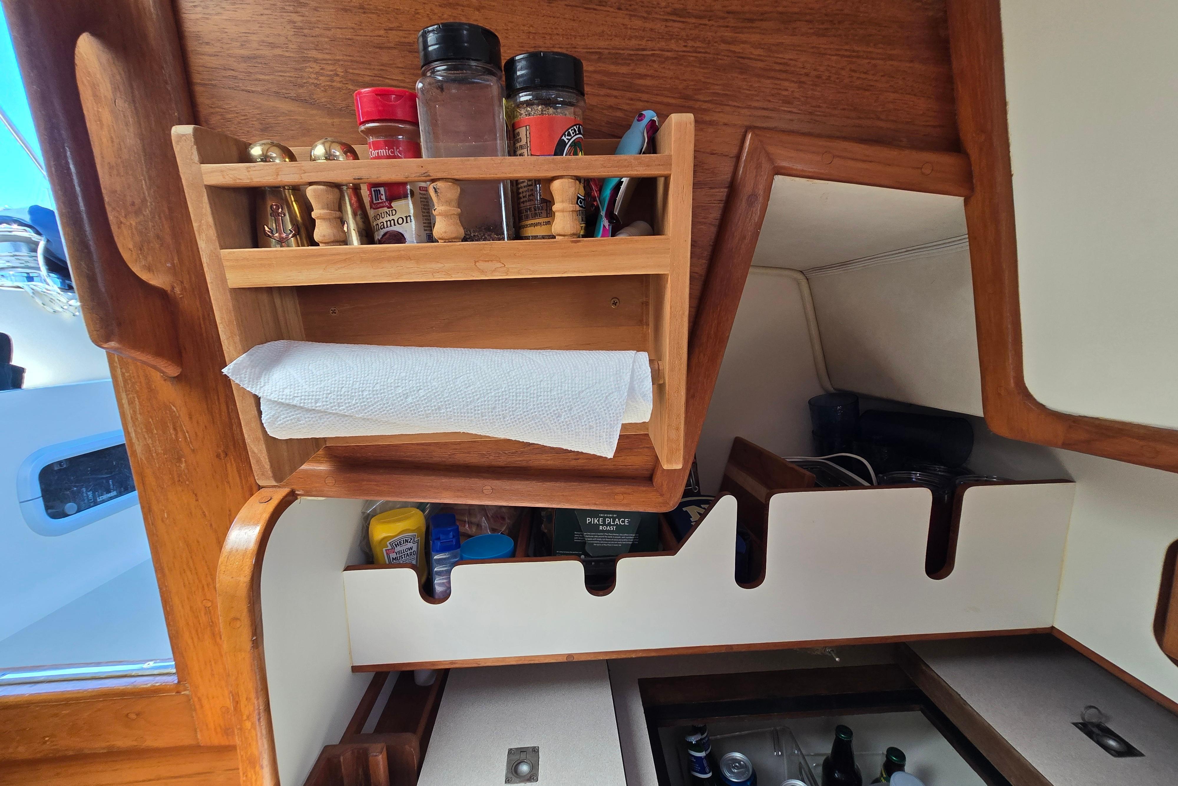 Wooden spice rack and storage in 1993 Caliber 35 boat kitchen.
