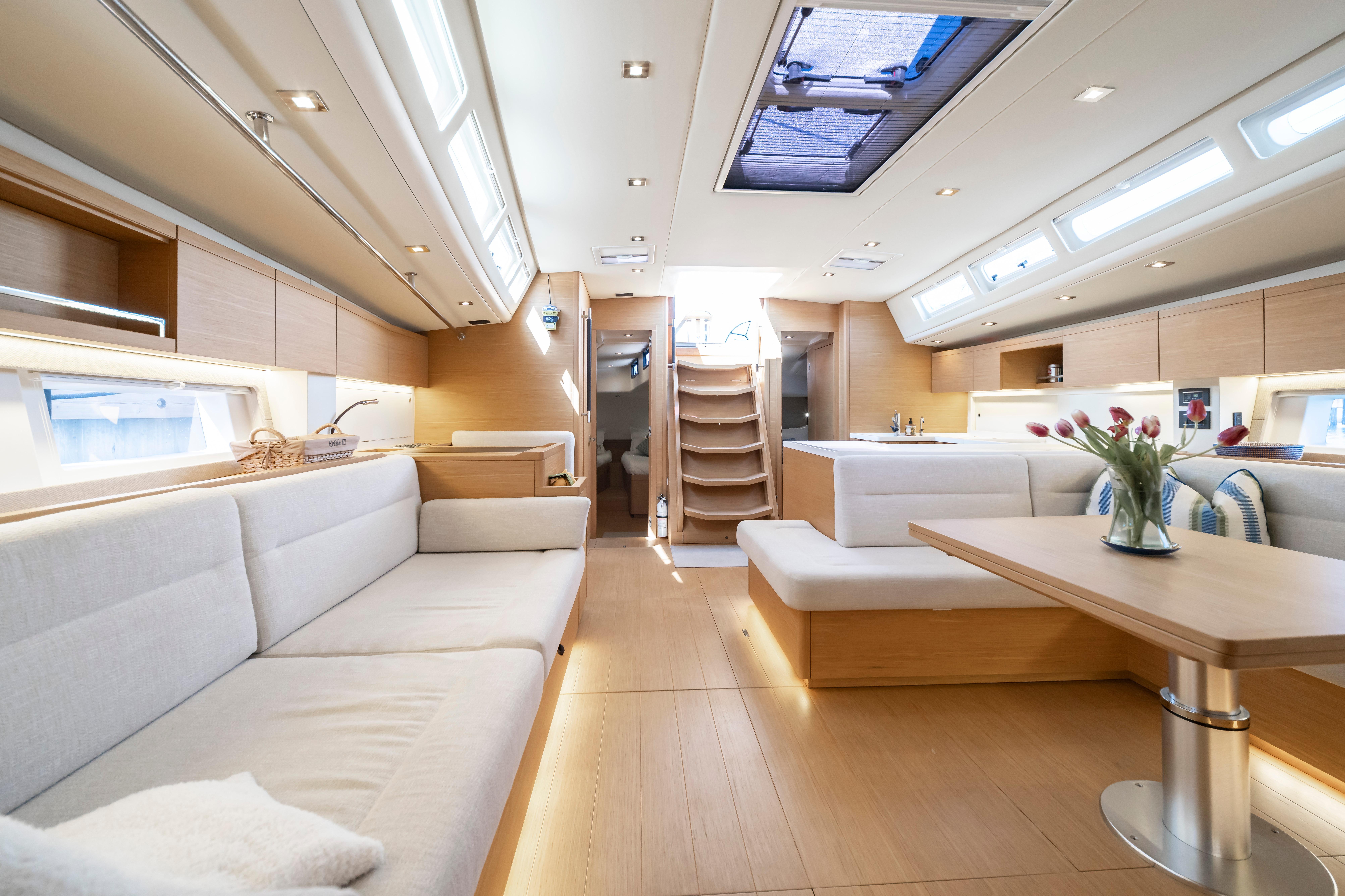 Luxurious interior of 2016 Grand Soleil 58 yacht with modern furnishings and natural light.