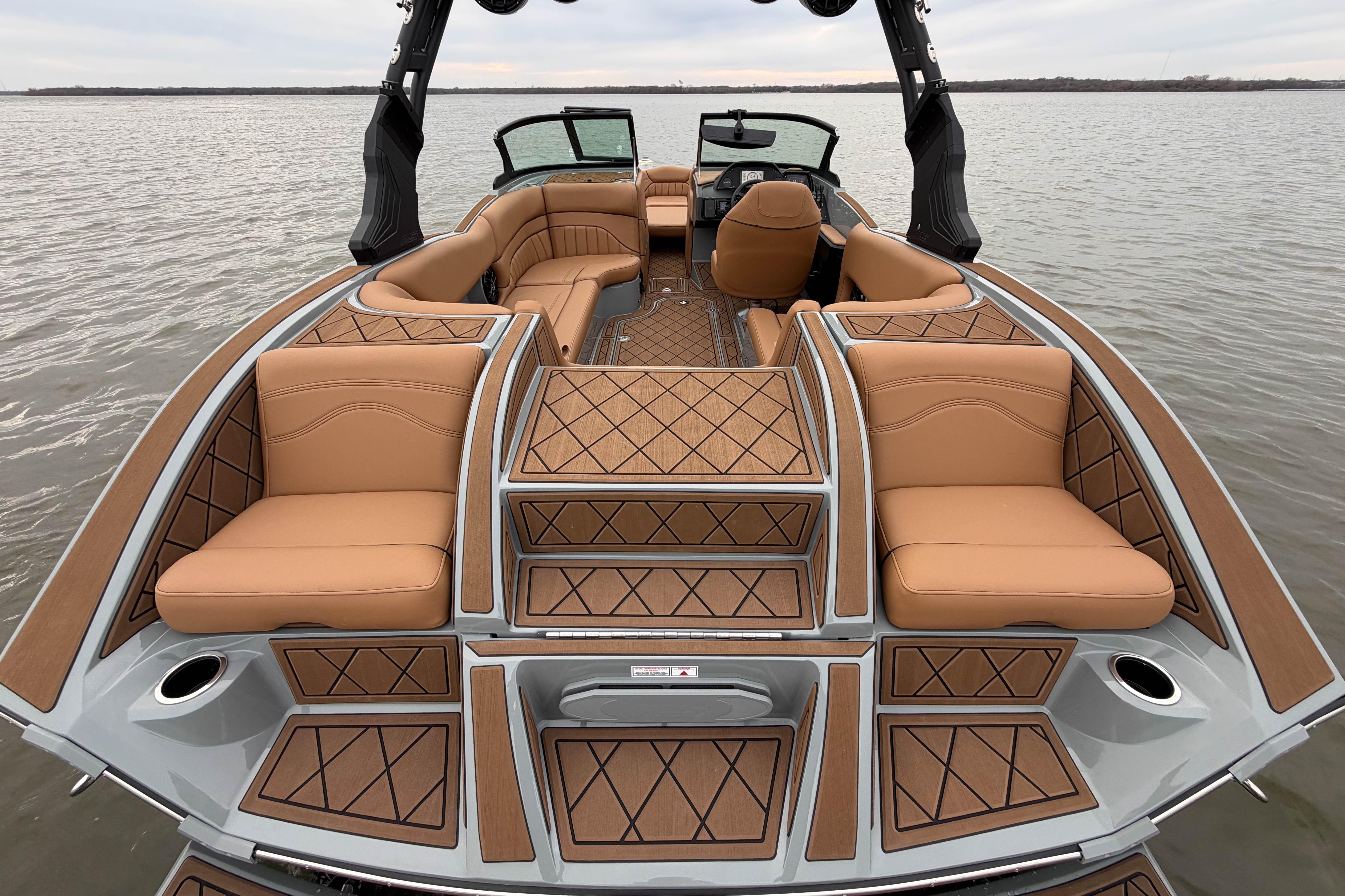 2026 MB B52 21 Alpha boat interior with luxurious tan seating and elegant design.