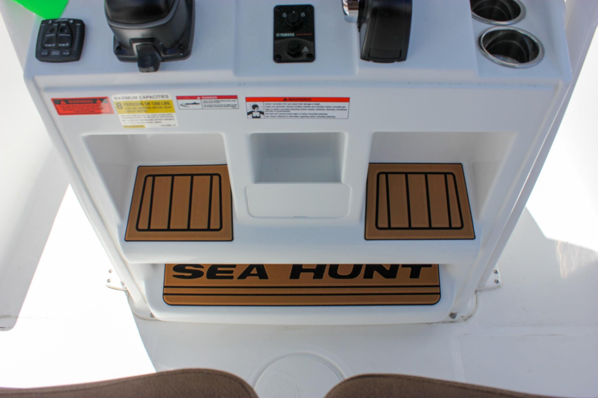 2027 Sea Hunt Ultra 234 console with controls and cup holders.