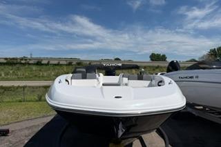 2026 Tahoe T18 boat on display under a clear blue sky.