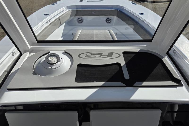 2026 Sea Hunt Ultra 275 Coffin Box boat interior with dashboard and seating area.