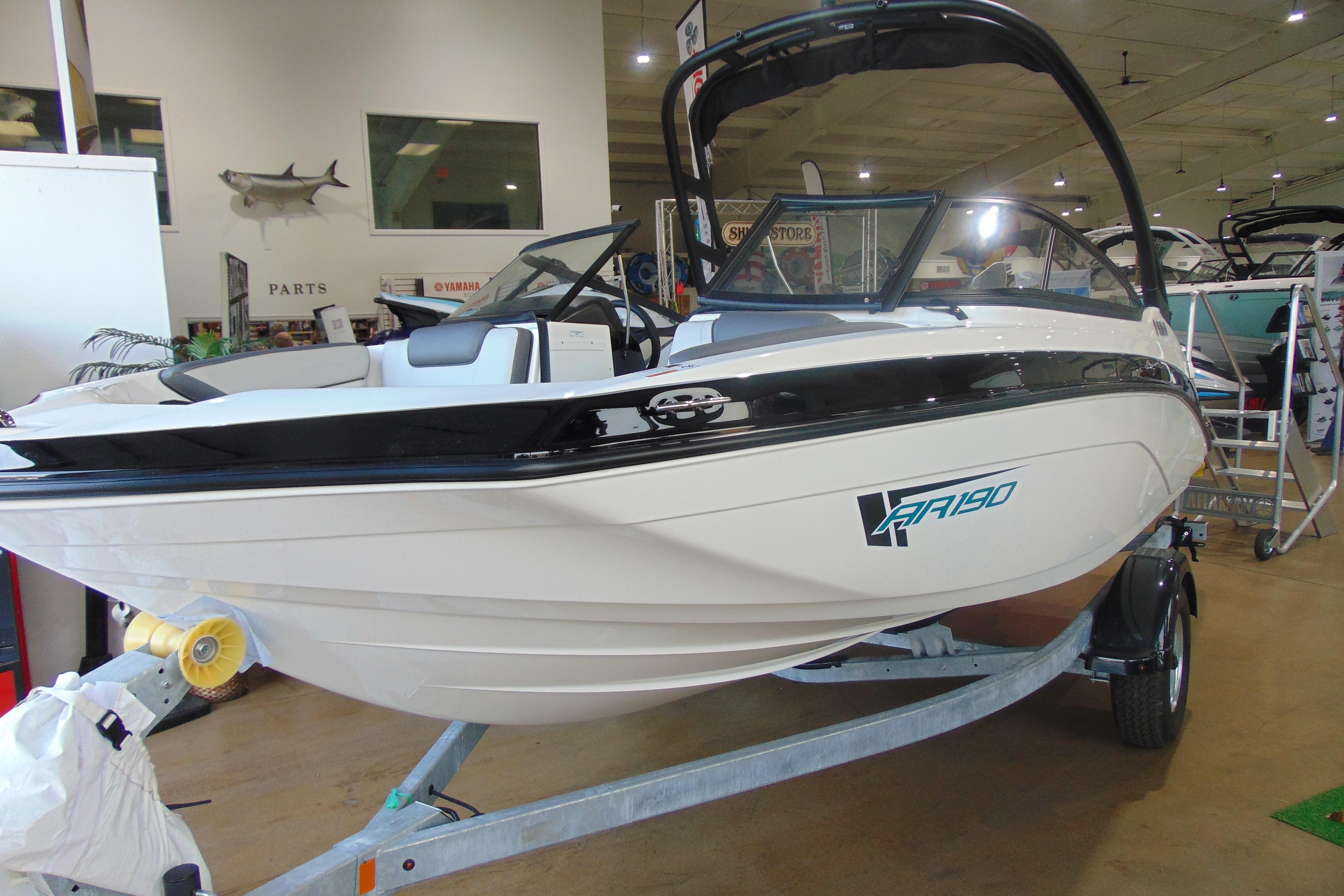 2026 Yamaha Boats AR190 displayed indoors on a trailer, showcasing sleek design.