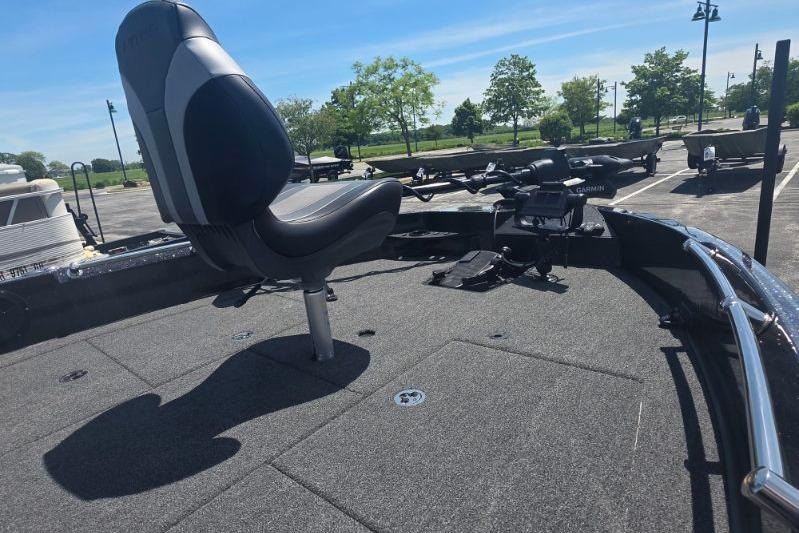 Fishing boat deck with seat, Nitro ZV21 model, 2026, parked outdoors under clear sky.