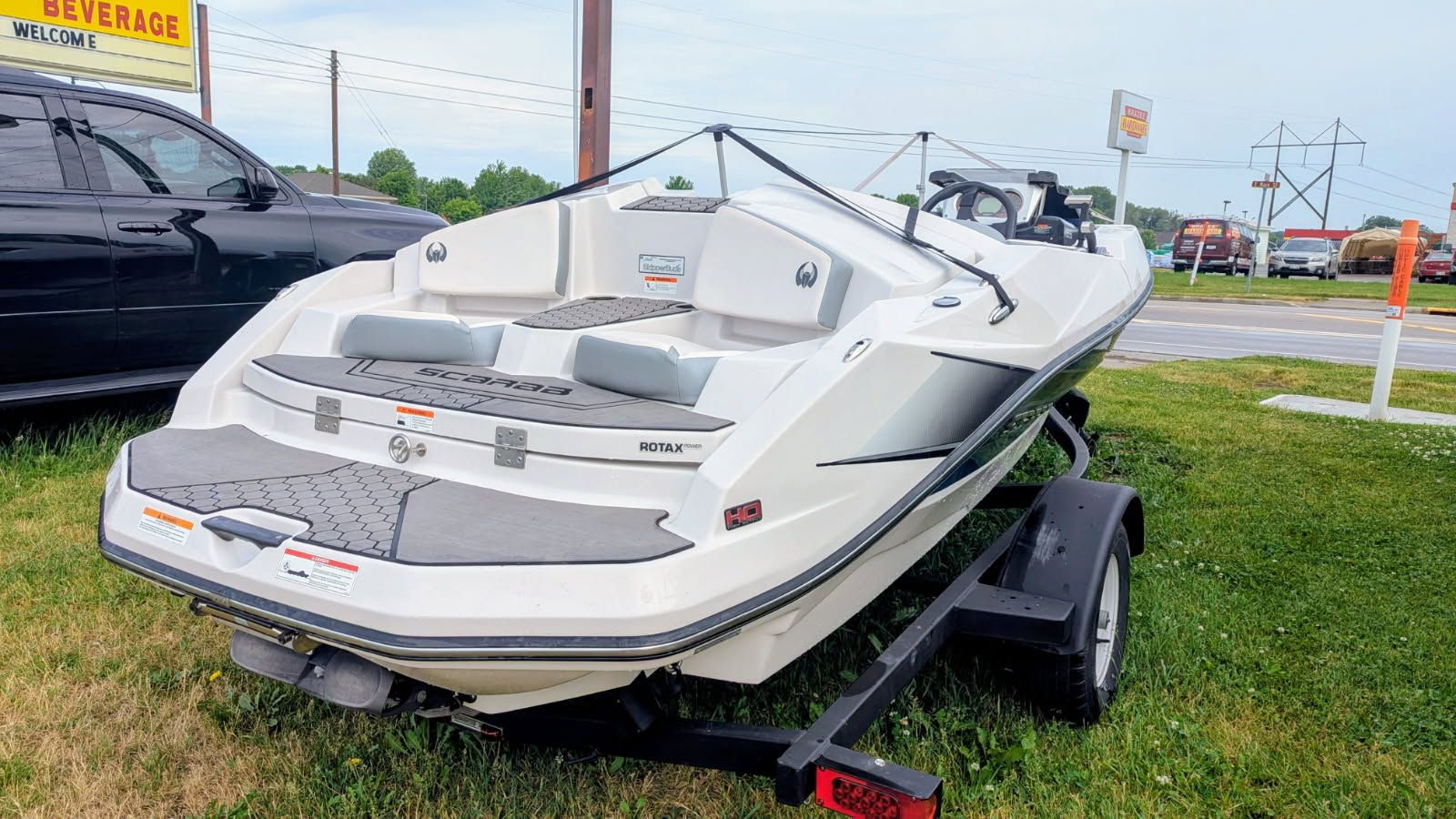 2017 Scarab 165 H.O. boat parked on trailer.