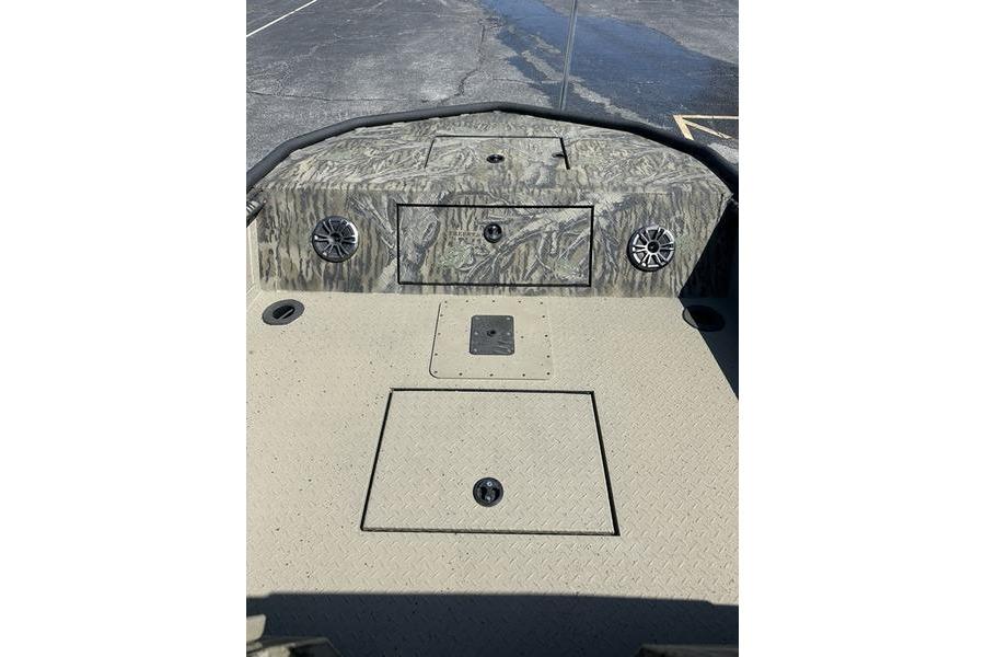 2025 SeaArk Predator 300 AK boat deck with storage compartments and speakers.