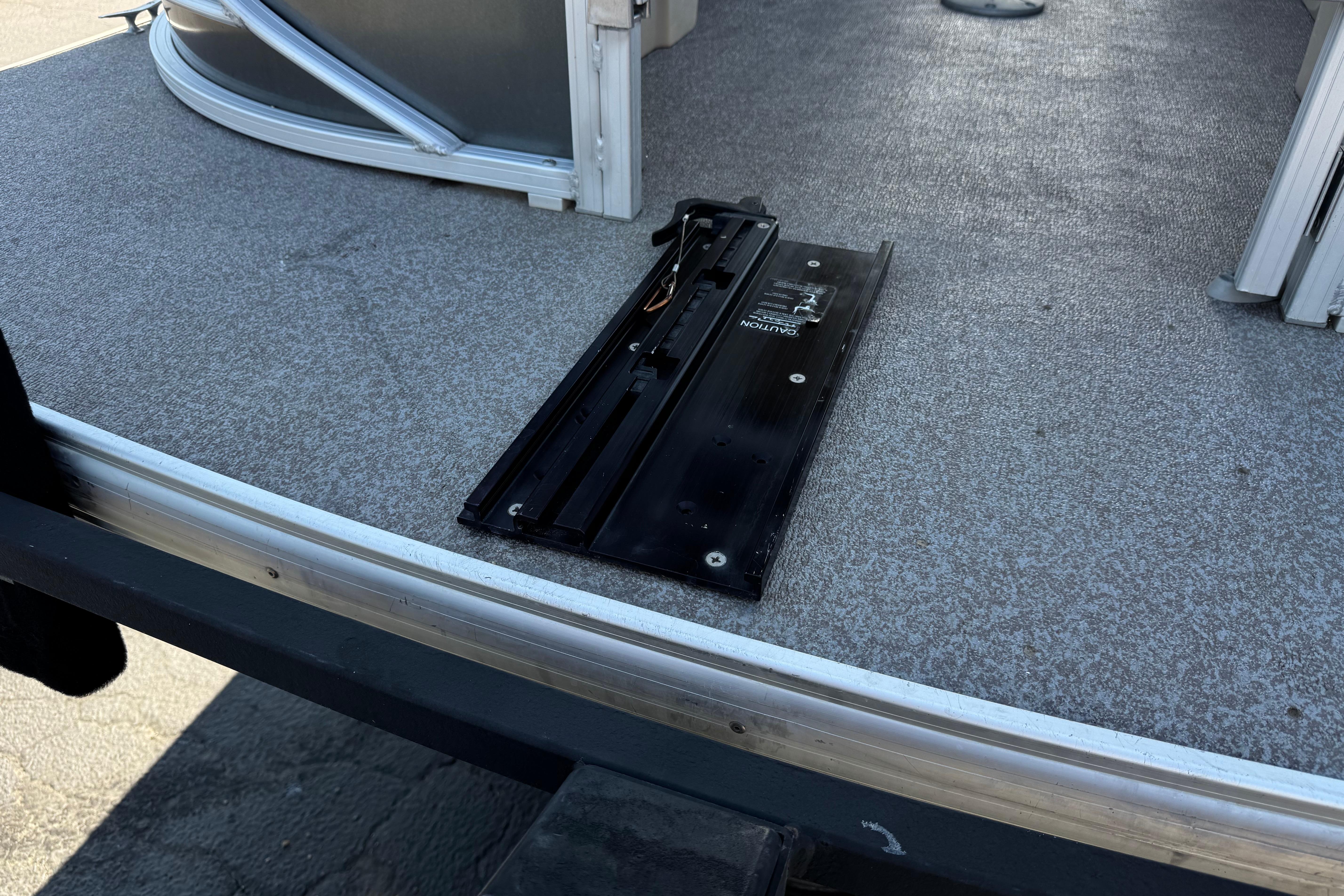 2018 Sun Tracker SportFish 22 DLX deck with mounted accessory track.