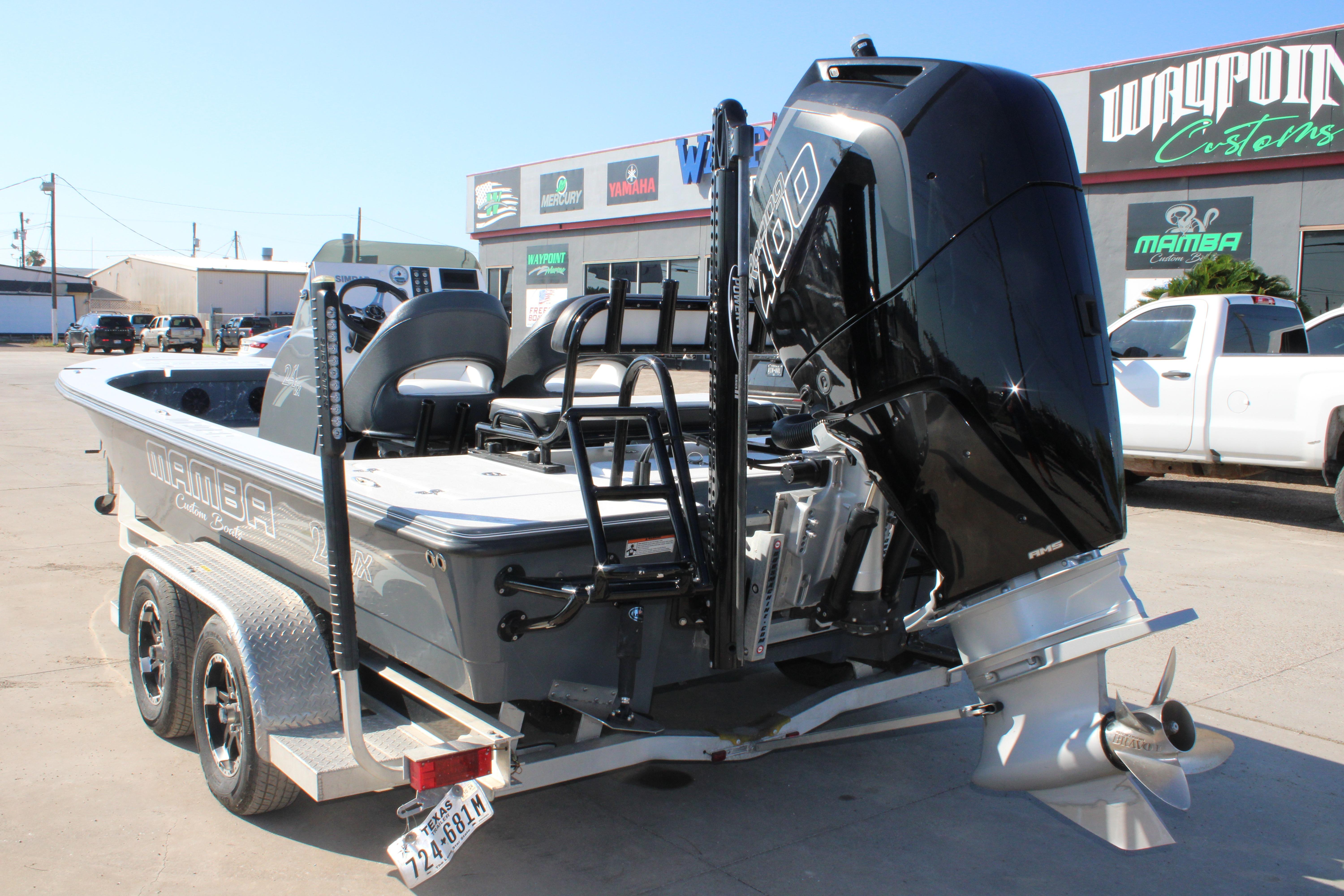 2023 Mamba 24VX boat on trailer with powerful outboard motor.