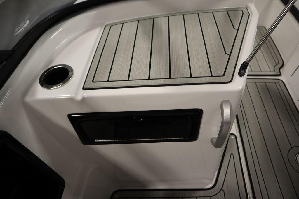 Interior view of 2026 Yamaha Boats 195S, featuring sleek deck design and cup holder.