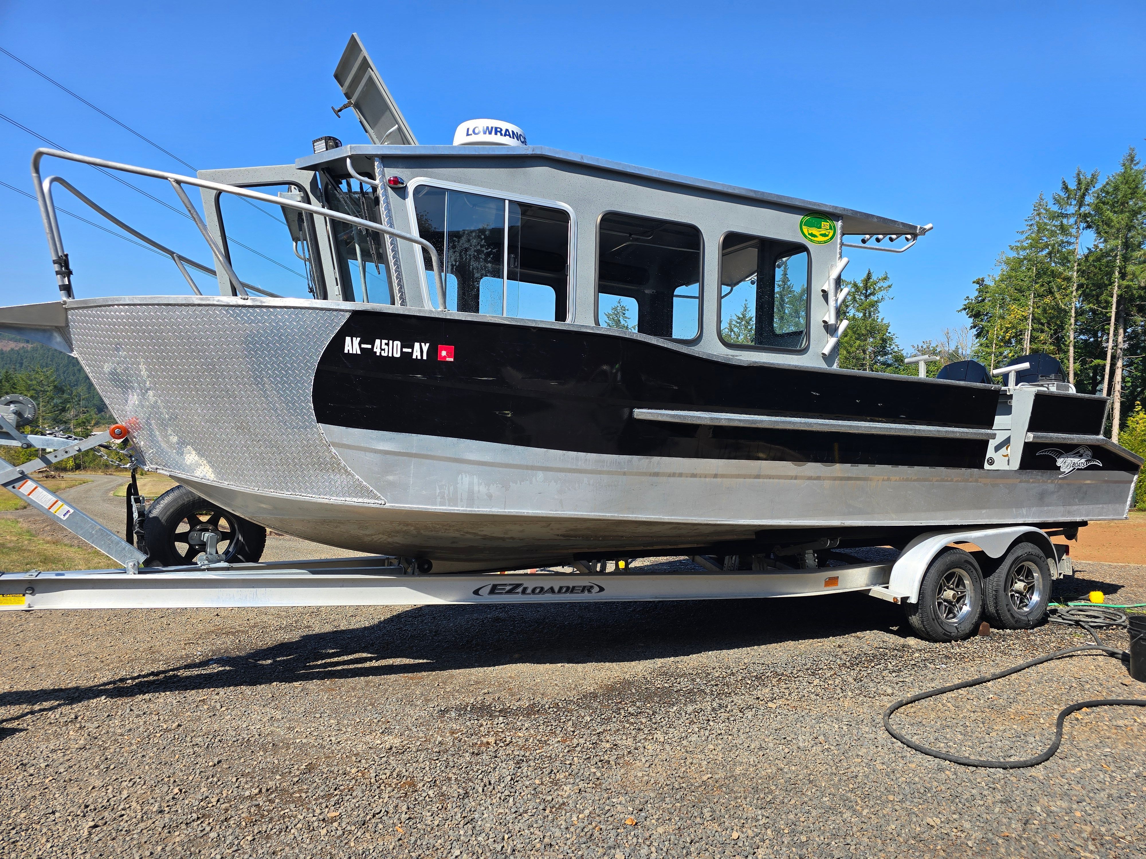 Custom Alaskan Explorer 2025 on trailer, shiny and ready for adventure.