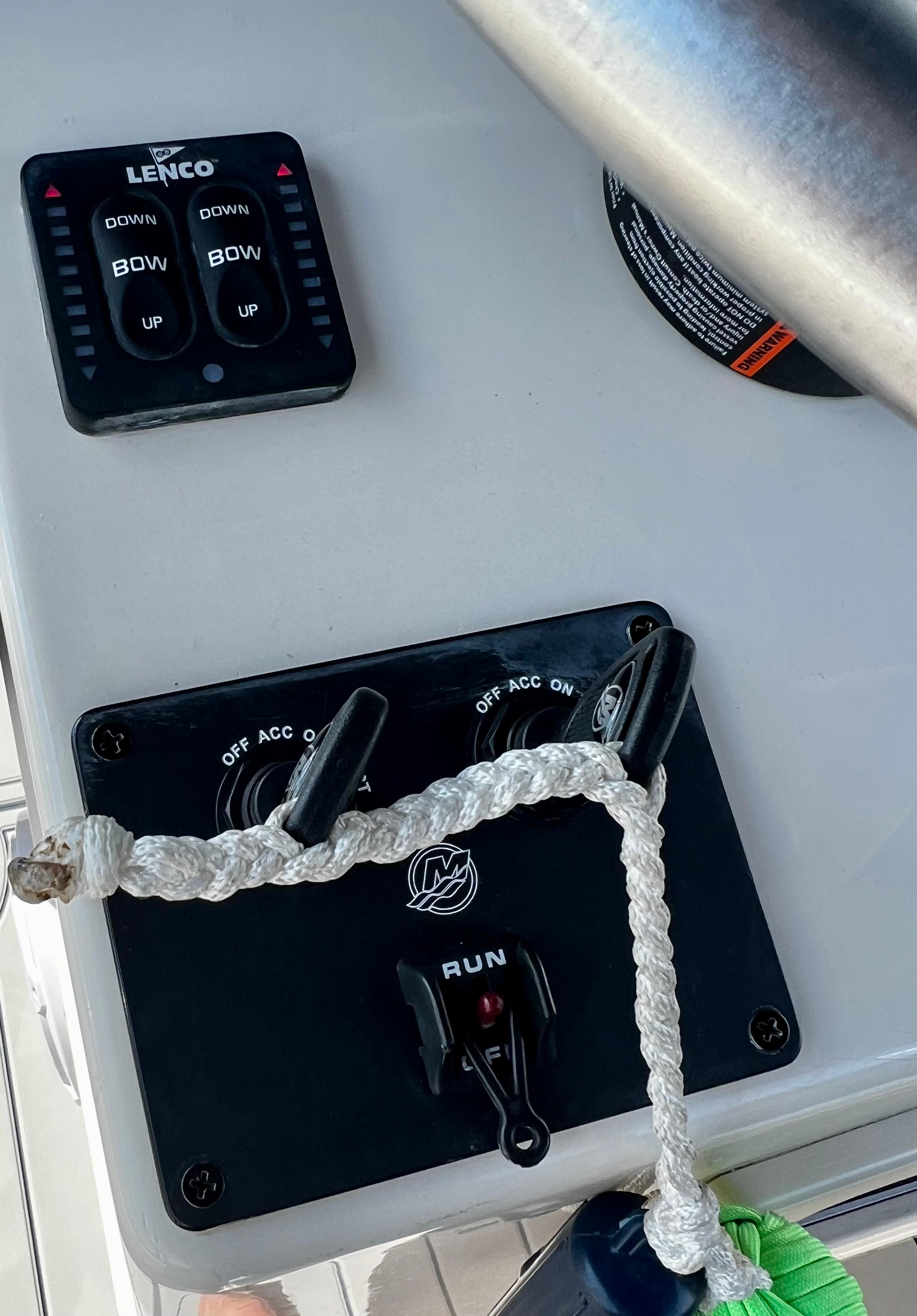 Control panel of a 2002 Parker 2500 Special Edition boat with Lenco trim tab switches.
