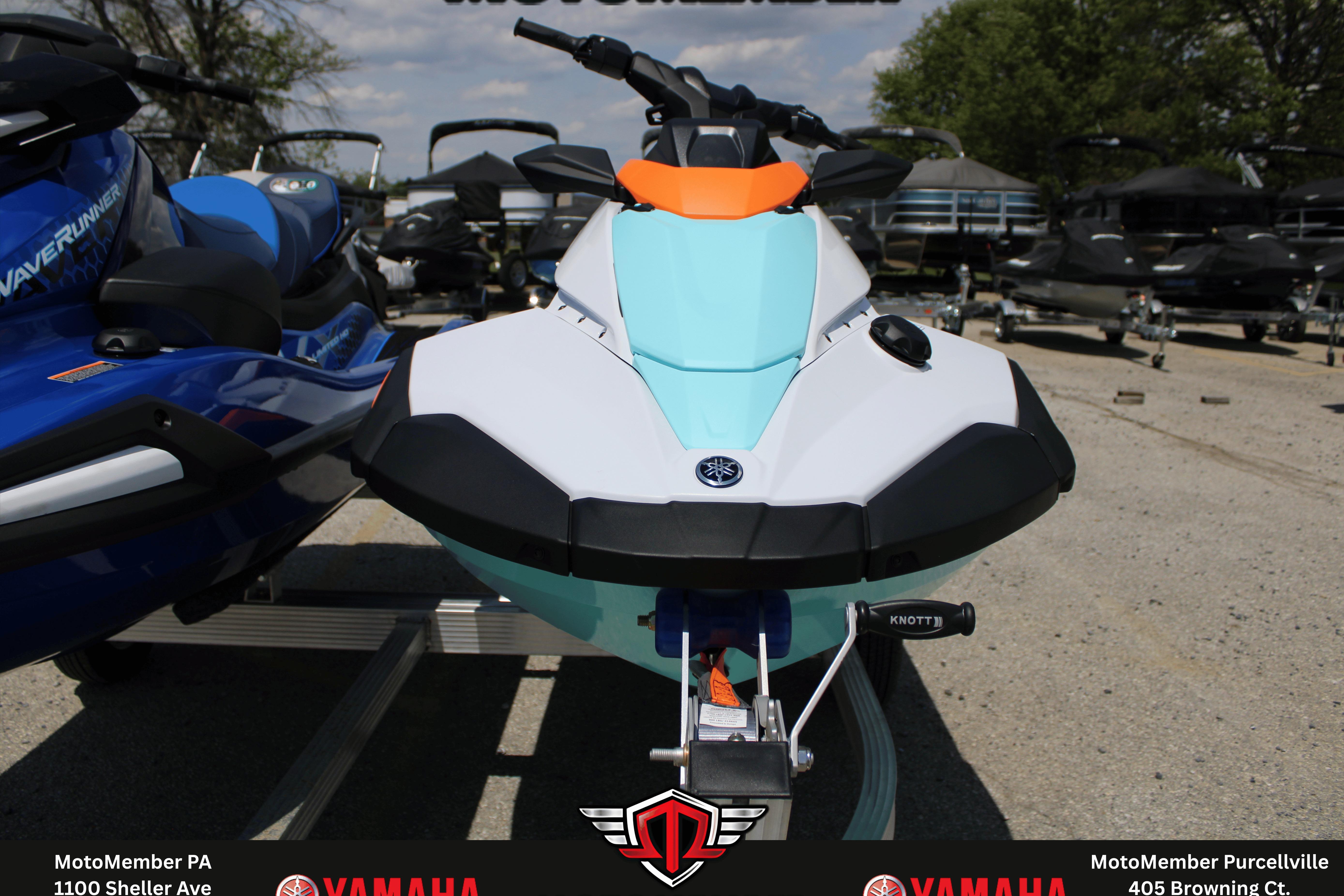 2026 Yamaha WaveRunner JetBlaster LTD in vibrant colors, displayed outdoors on a trailer.