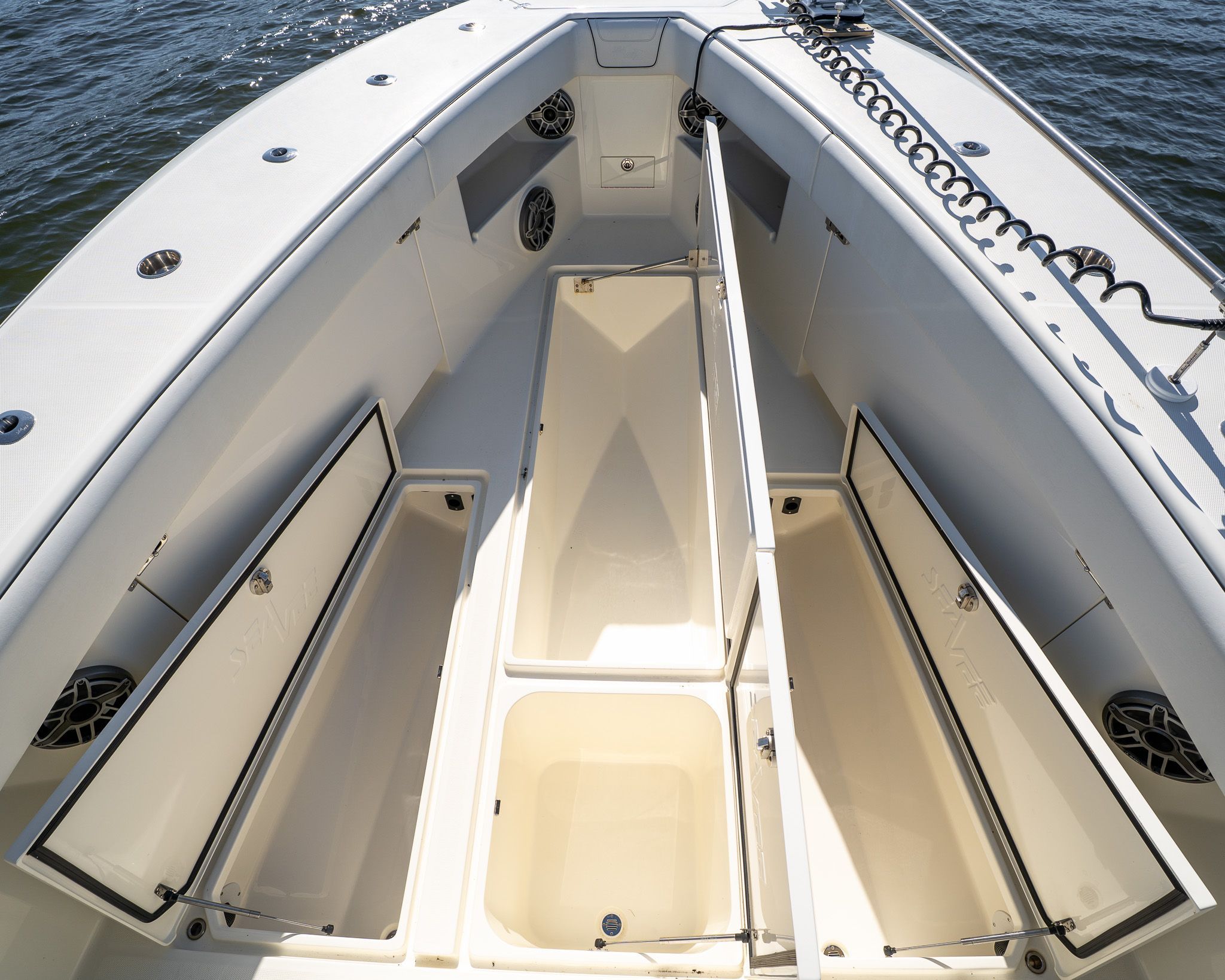 The image shows the deck of a SeaVee 370Z boat with multiple storage compartments.