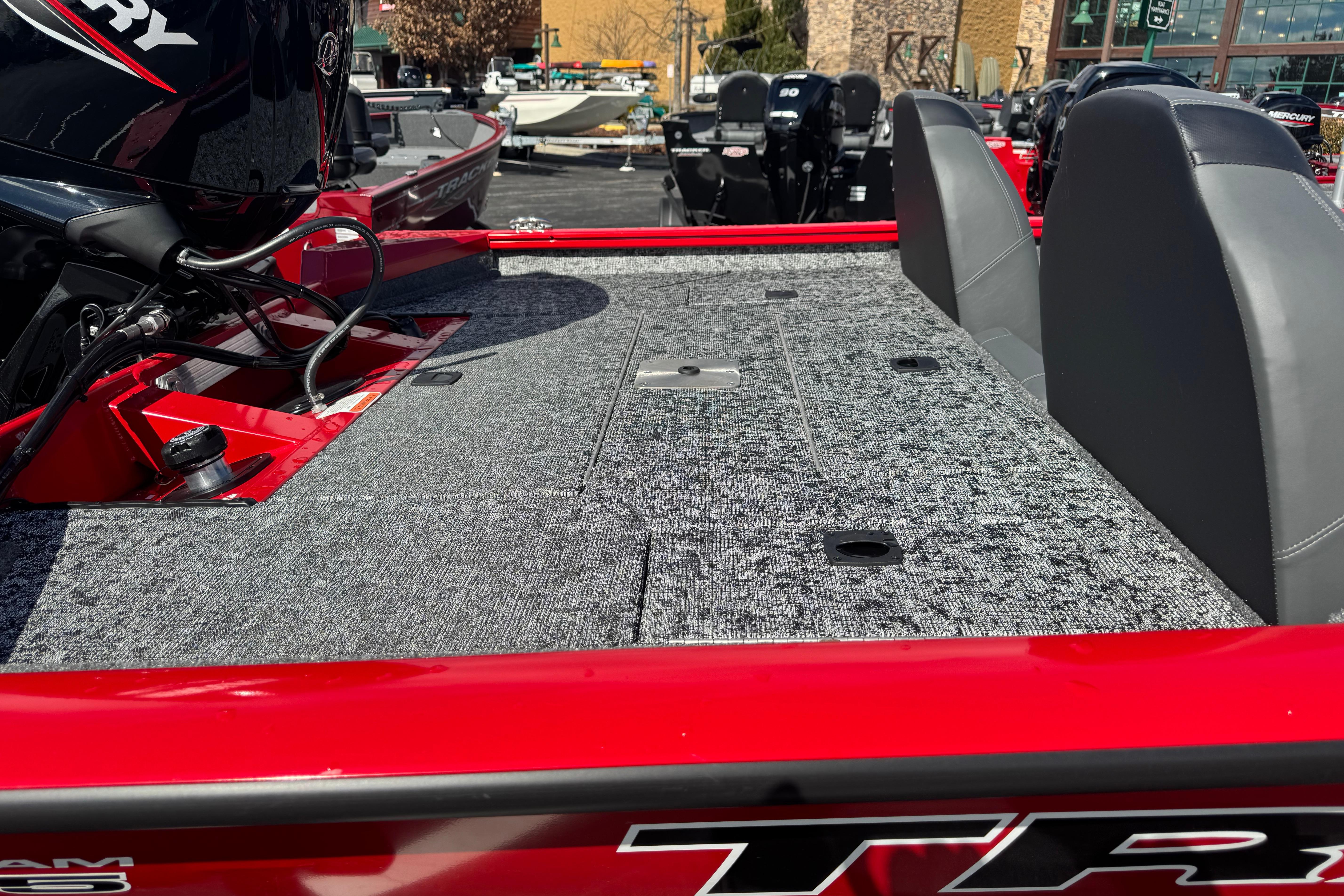 2026 Tracker Pro Team 175 boat with red exterior and spacious deck.