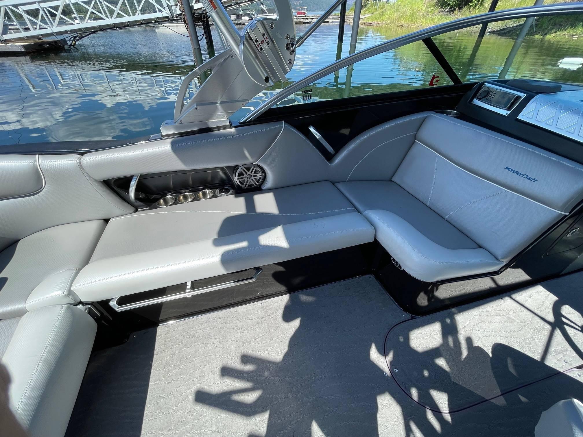 2016 MasterCraft X23 boat interior with gray seating and sleek design.