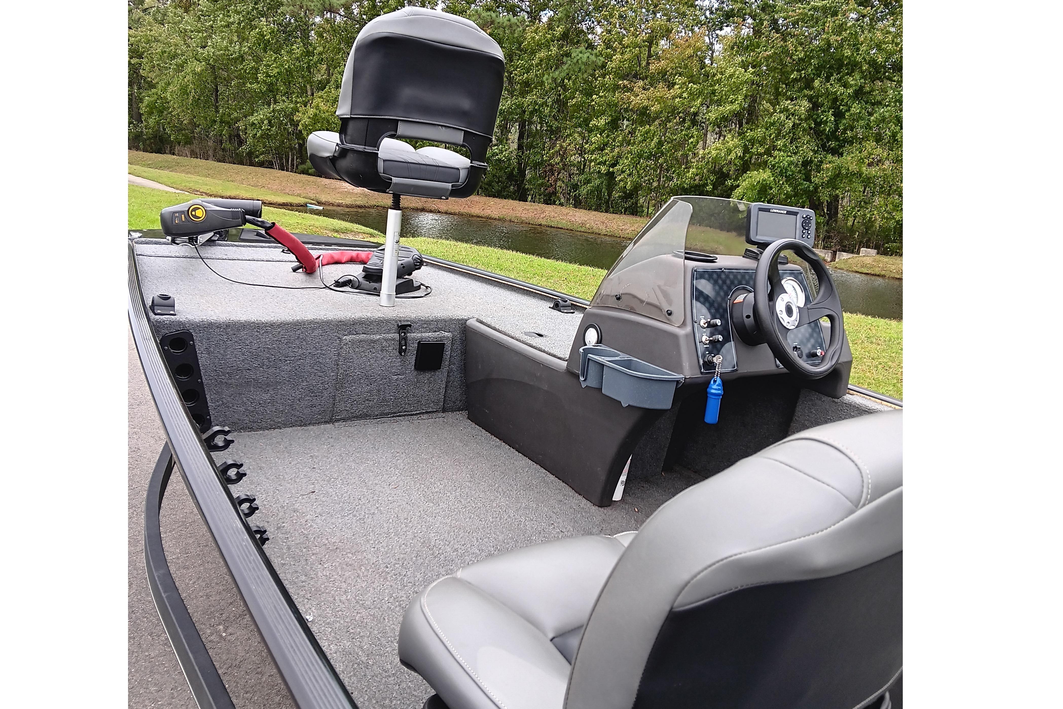 2023 Tracker Bass Tracker Classic XL boat interior with steering console and seating.