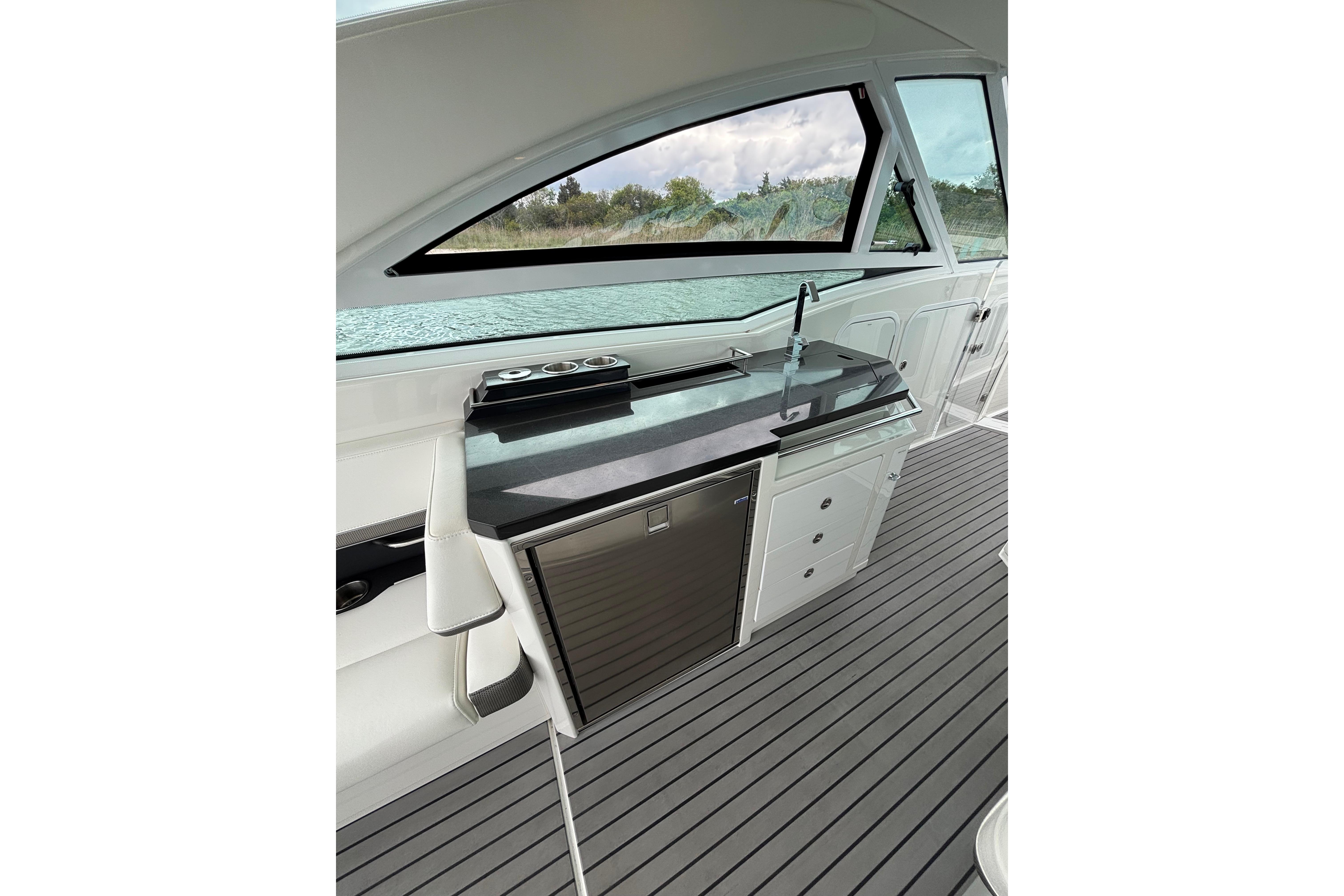 2017 Formula 430 Super Sport Crossover interior with sleek kitchenette and modern design.