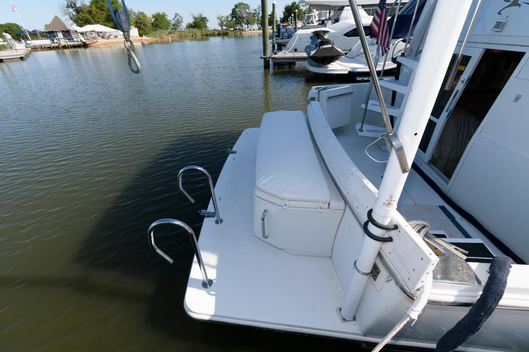1997 Carver 400 Cockpit Motor Yacht docked at marina.
