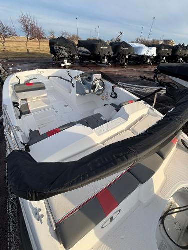 2023 Tahoe T16 boat with sleek design, docked outdoors.