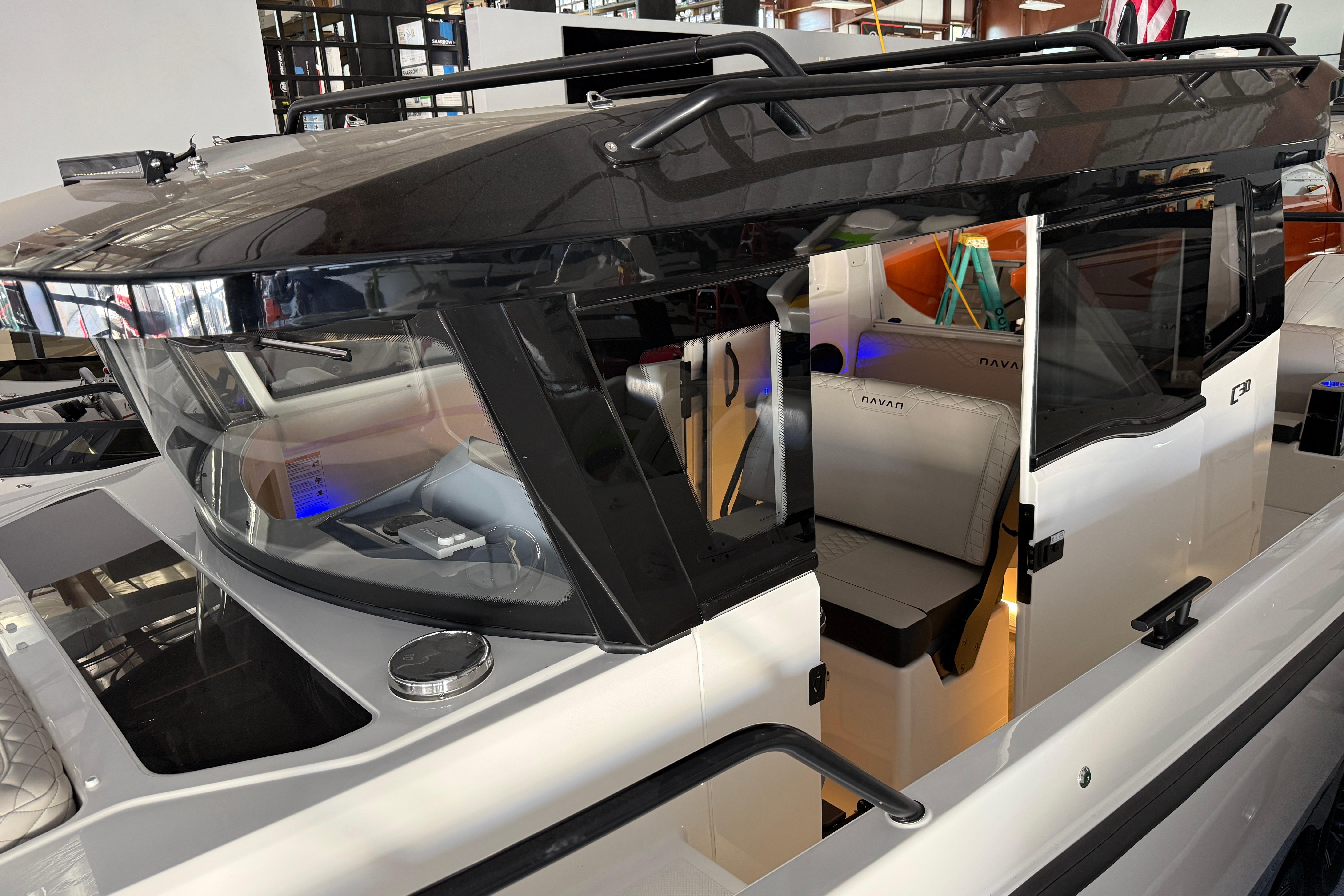 2025 Navan C30 boat with sleek design and modern interior, docked indoors.