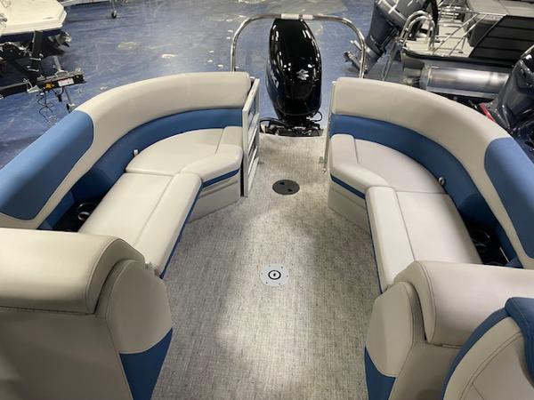 2025 South Bay LE pontoon boat interior with blue and white seating.