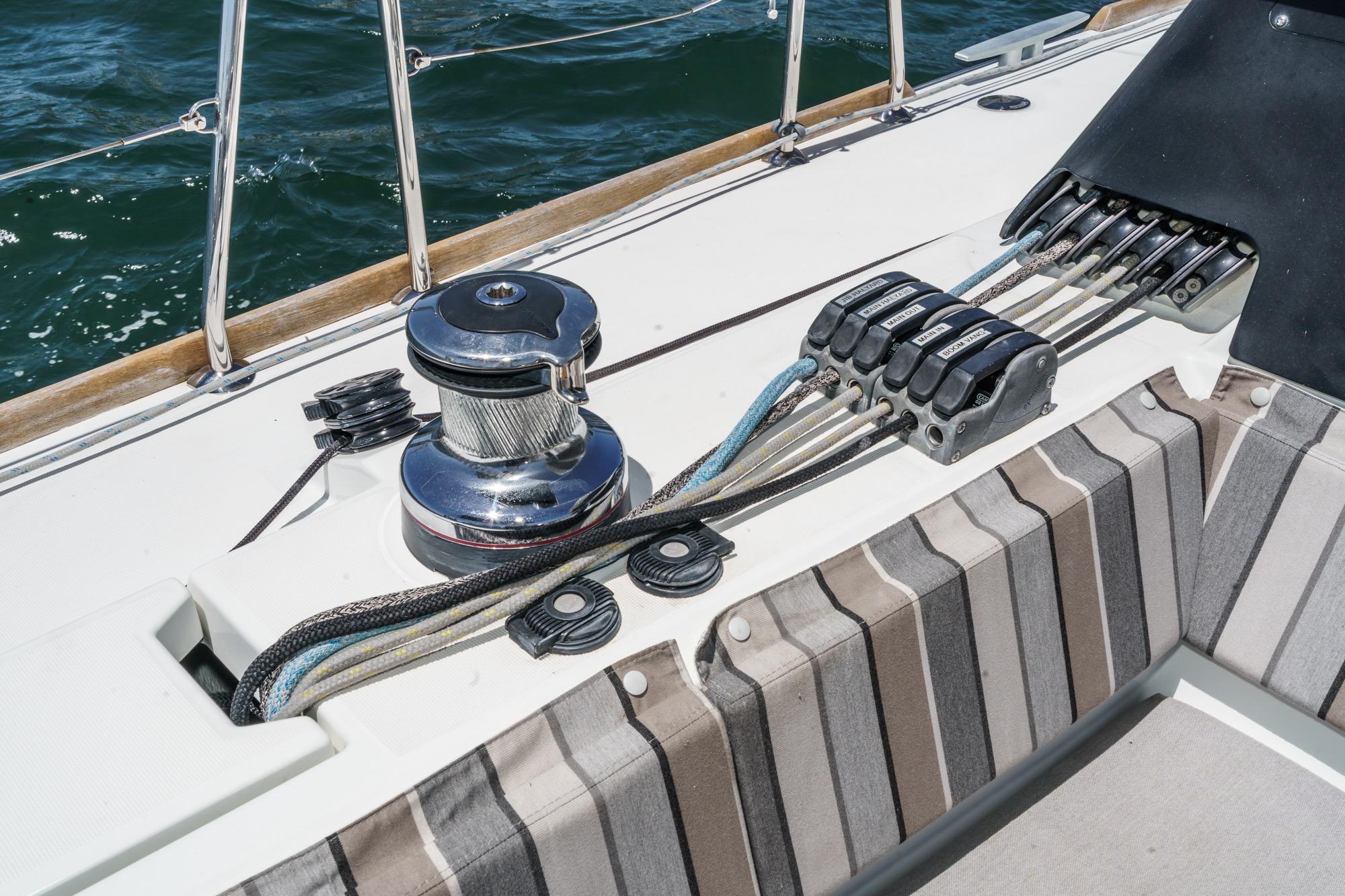 Deck of 2017 Beneteau Sense 50 sailboat with winch and control lines.