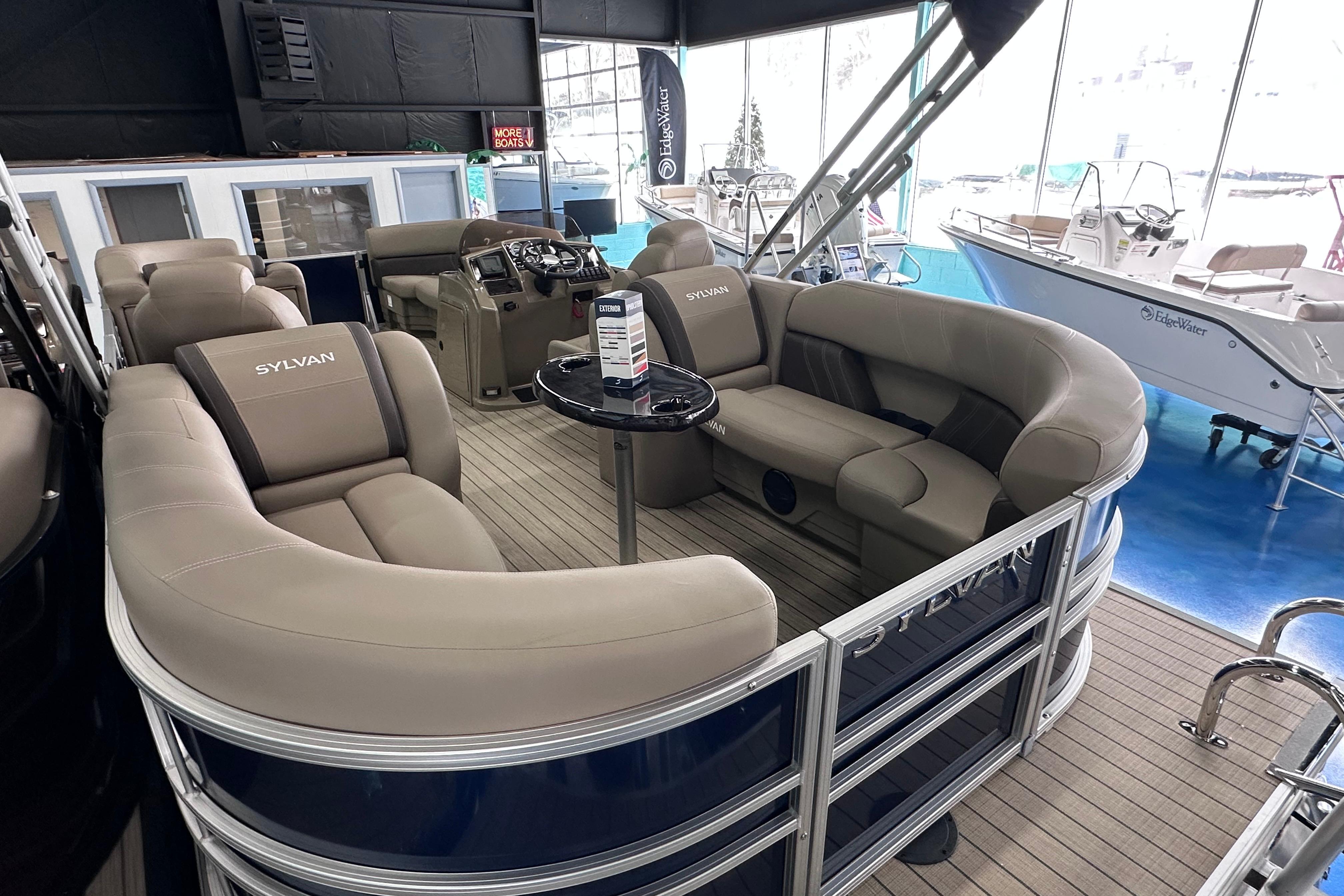 Luxurious interior of 2026 Sylvan Mirage 8522 LZ pontoon boat with plush seating.