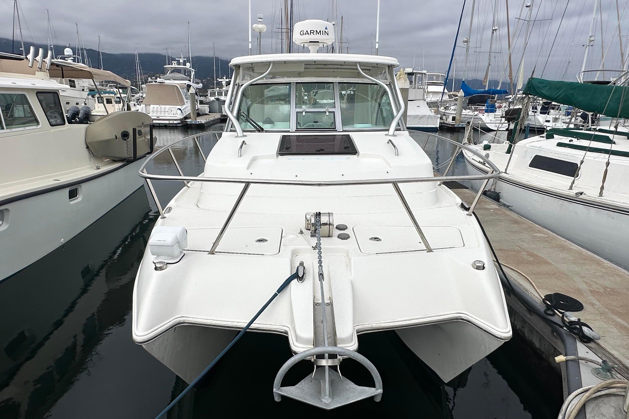 2013 Glacier Bay 2680 Coastal Runner boat docked at marina, front view.
