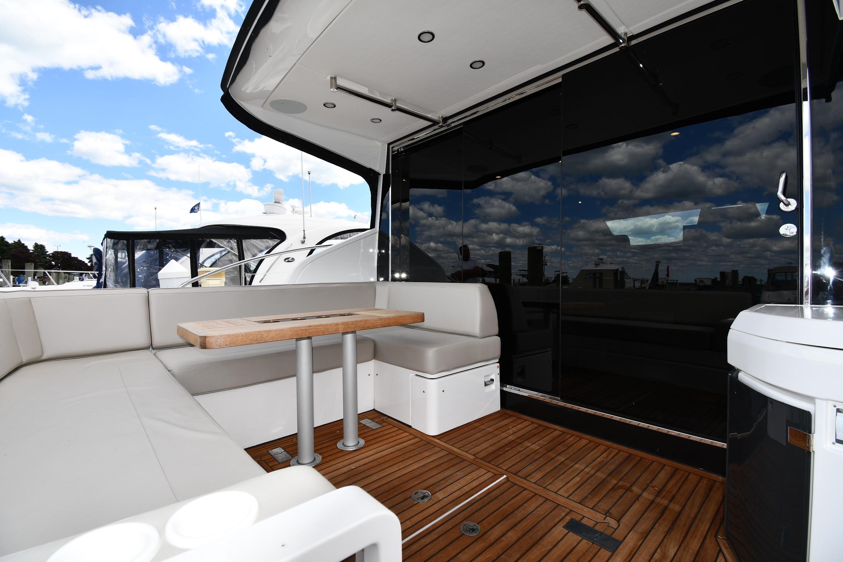 Luxurious 2024 Fairline G50 Targa yacht interior with sleek seating and wooden flooring.