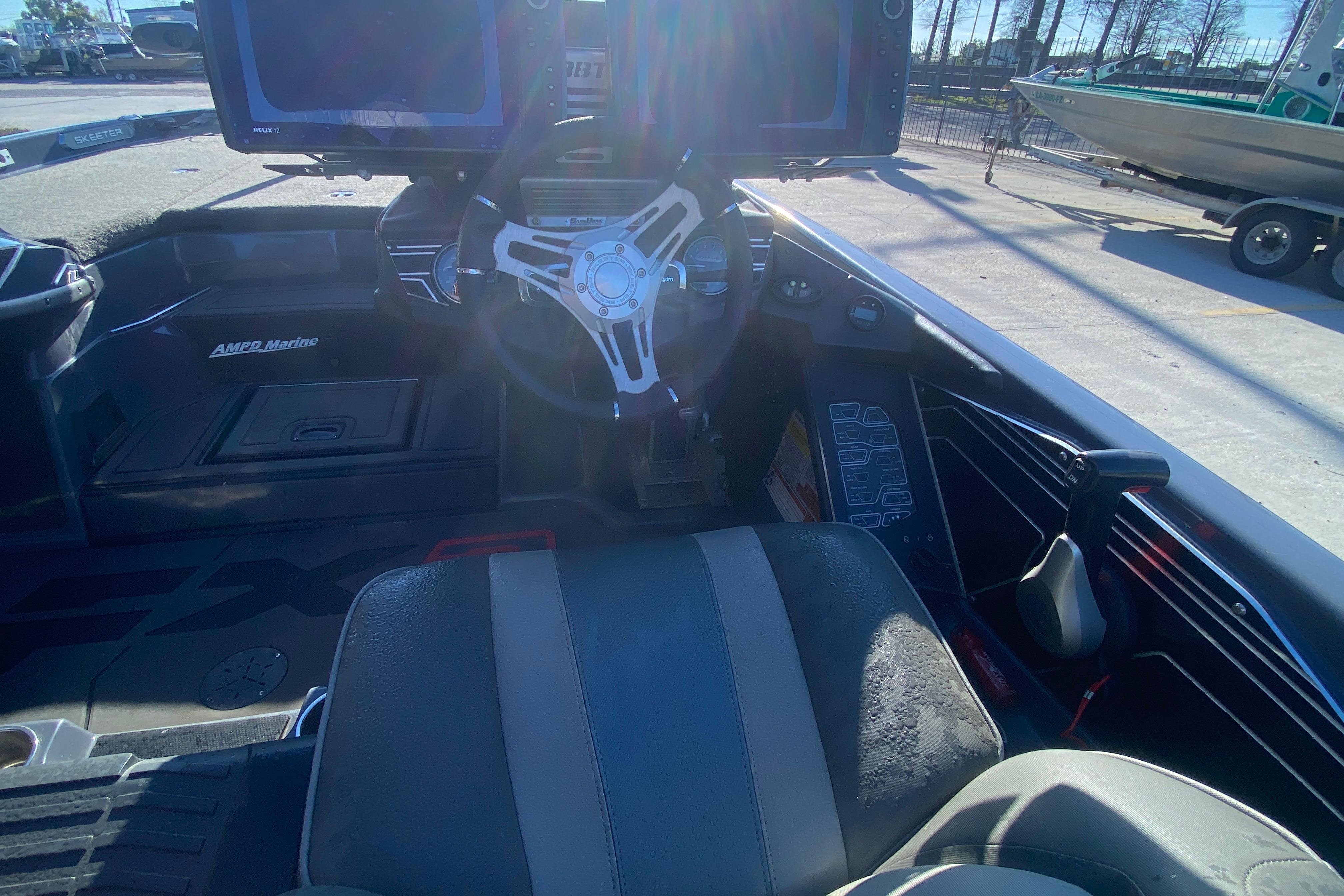 2020 Skeeter FXR20 Limited boat cockpit with steering wheel and control panel.