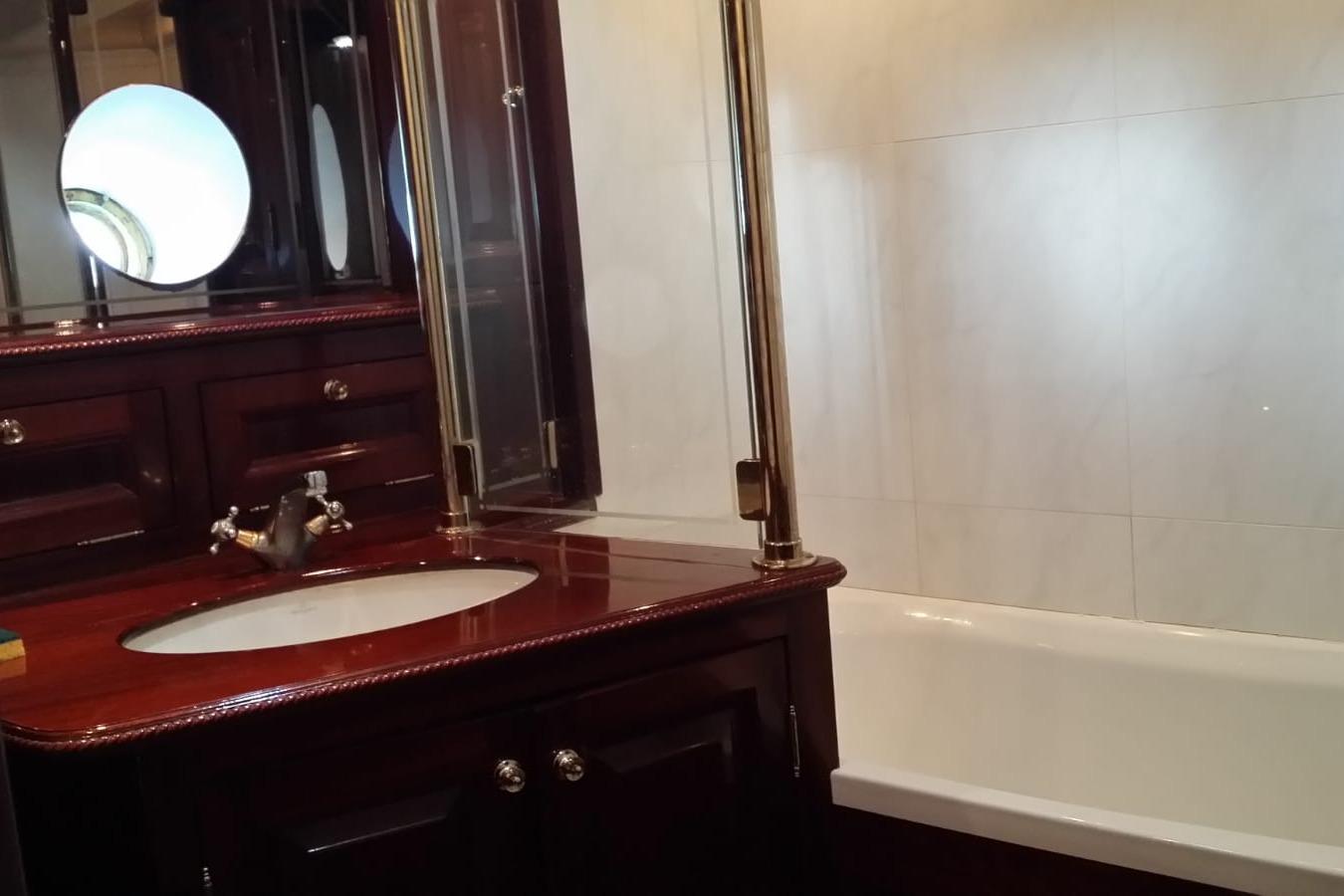 Luxurious wooden bathroom interior on 1930 Frederikksund Gaff Topsail Schooner.